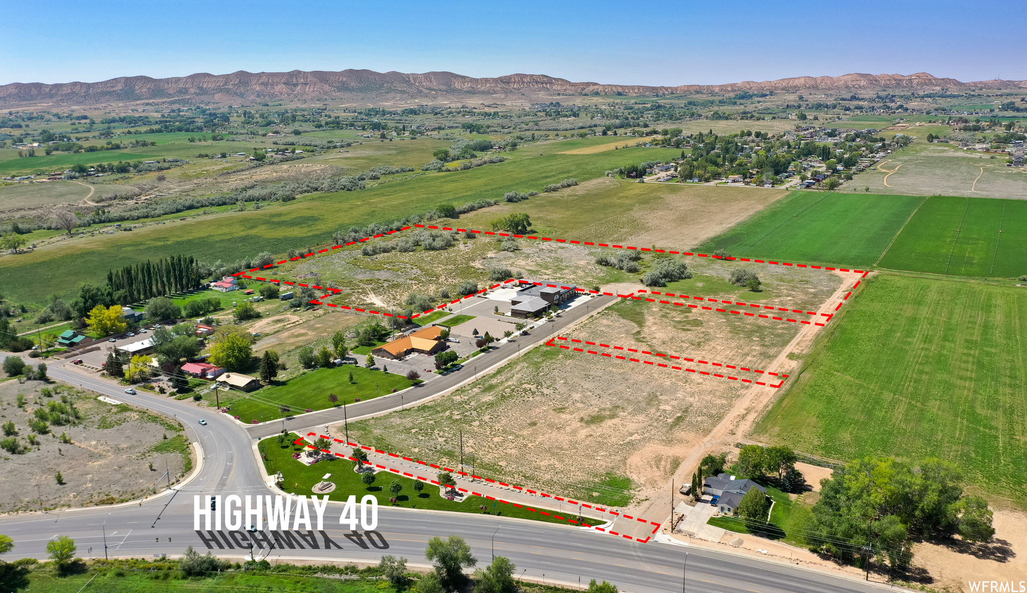 Exceptional commercial land located adjacent to the Naples City Fire Department with paved road access and outstanding visibility in one of the area's most strategic growth corridors. Conveniently positioned just minutes from Hwy 40, this property offers easy access for customers, employees, and future development opportunities. This versatile parcel presents endless potential for commercial, mixed-use, or investment development. The high-traffic location and strong accessibility make it ideal for retail, office space, service-based businesses, storage facilities, or future redevelopment concepts. With continued growth throughout the Naples and Vernal area, investors and developers may also explore the potential for rezoning to higher-density or multi-family residential use, subject to city approval. The property's location near existing infrastructure, emergency services, schools, and major transportation routes creates an attractive setting for townhomes, apartments, workforce housing, or mixed-use residential development. Whether you're seeking a commercial development site today or planning for future residential expansion, this property offers location & flexibility. Let's take a closer look. All information is deemed reliable. Buyer is advised to obtain independent information.