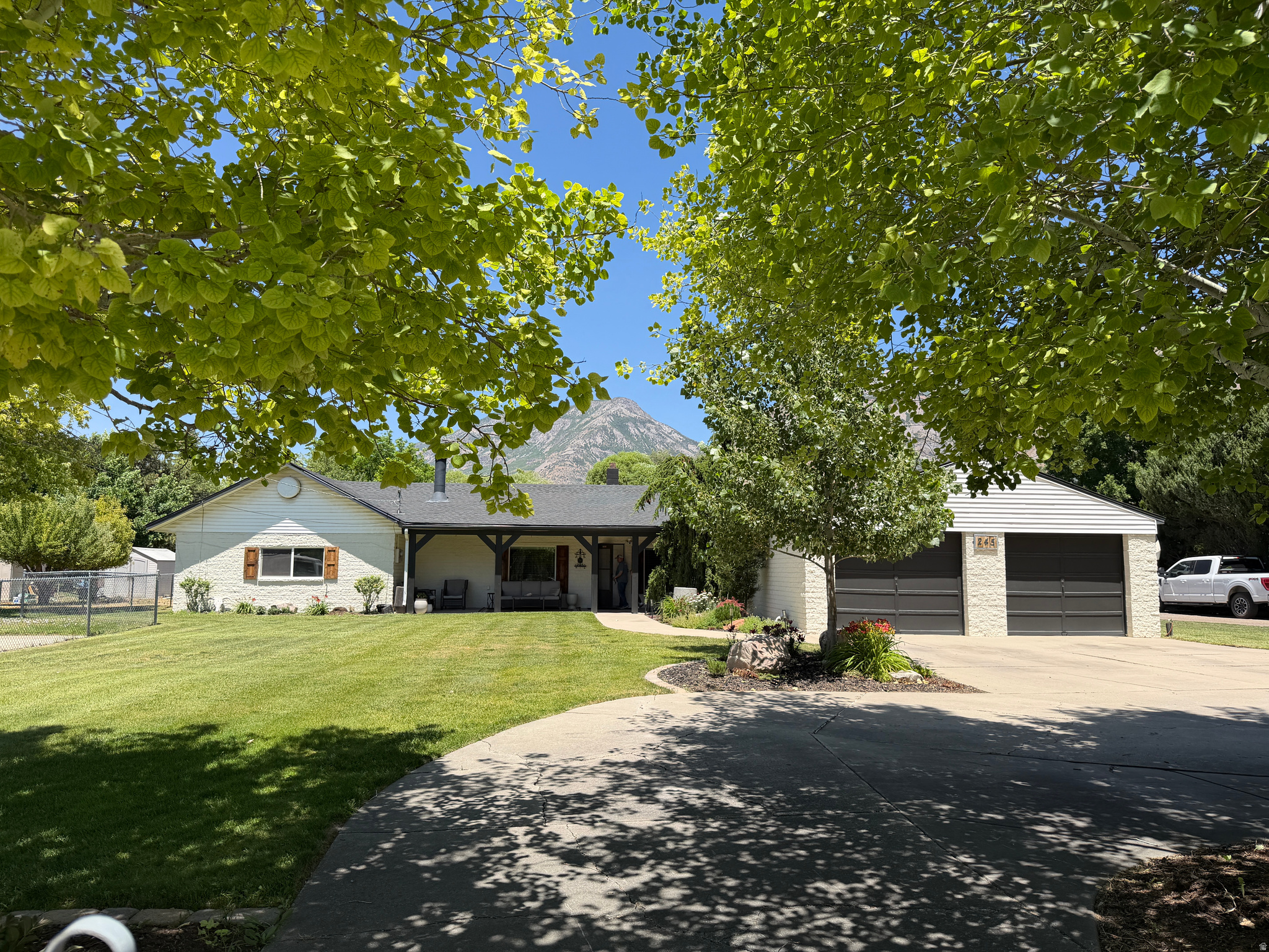 Beautiful .61-acre Lindon horse property with stunning mountain views, mature landscaping, RV hookups, multiple outbuildings, and convenient single level living.  The property features horse facilities, hay and equipment storage, expansive lawn area, shade trees, covered porch, outdoor living spaces, and abundant parking.  Inside you will find custom cabinetry and a warm inviting floor plan.  Room to add an extra bathroom where one used to exist.