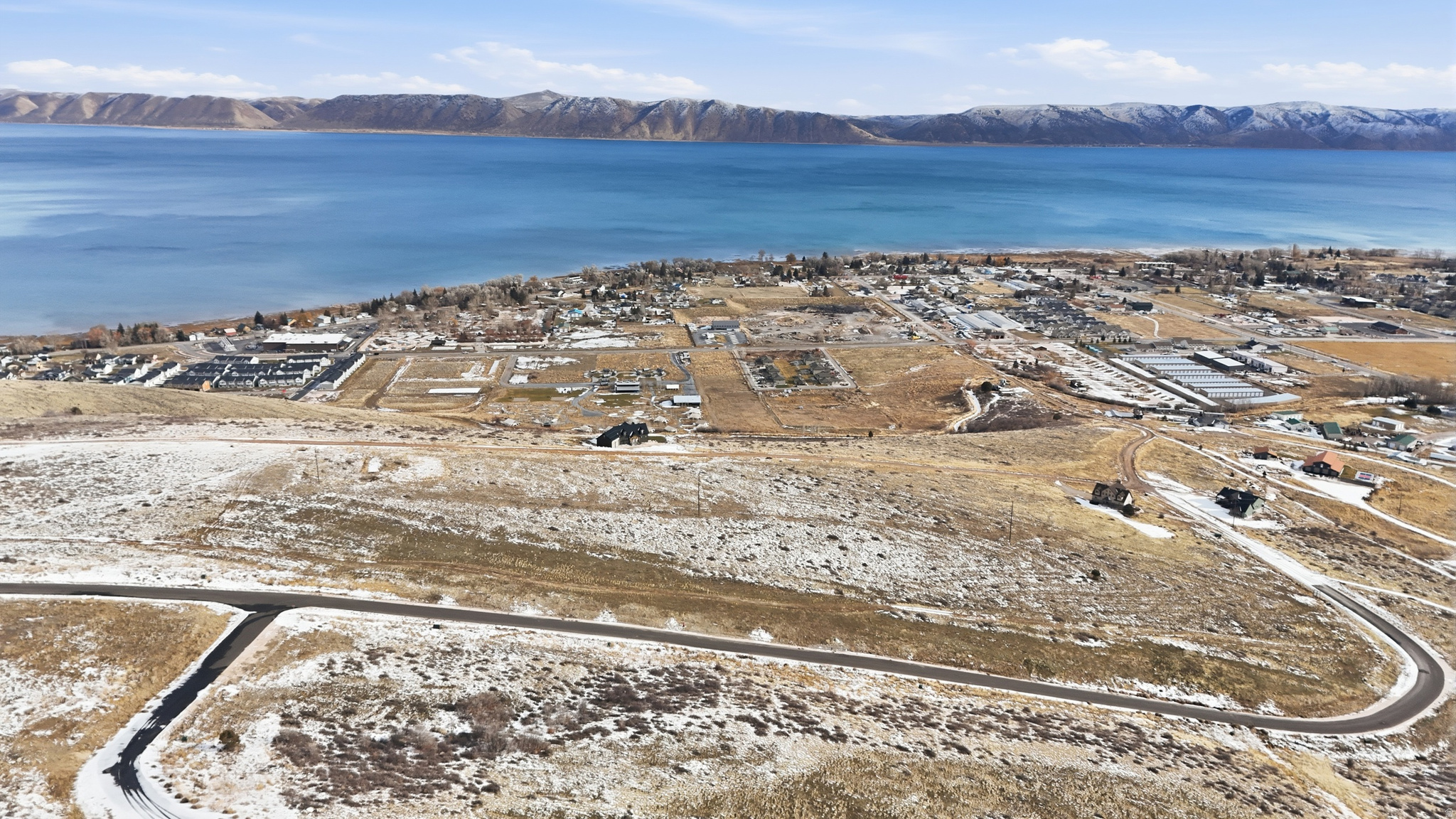 Enjoy breathtaking views of Bear Lake's turquoise-blue water from your own .89 acre property! This location is perfect for creating lasting family memories or taking advantage of approved short-term rental opportunities. Close to the Bear Lake marina within 1 mile of the property to launch your boat and Beaver Mountain Ski Resort is only 10-15 minutes away.  With direct access to miles of off-road trails for ATVs, dirt bikes, side-by-sides, snowmobiles, and snow bikes, you can easily explore surrounding areas such as Laketown, Randolph, Peter Sinks, Temple Peak, Boulder Mountain, Strawberry Valley, Hardware Ranch, and Monte Cristo. The property is also conveniently close to Garden City, where you can indulge in its famous raspberry shakes, whether you prefer to walk or ride your ORV. Water, electricity, and sewer are already stubbed to each lot, making this an ideal spot to build your Bear Lake getaway.