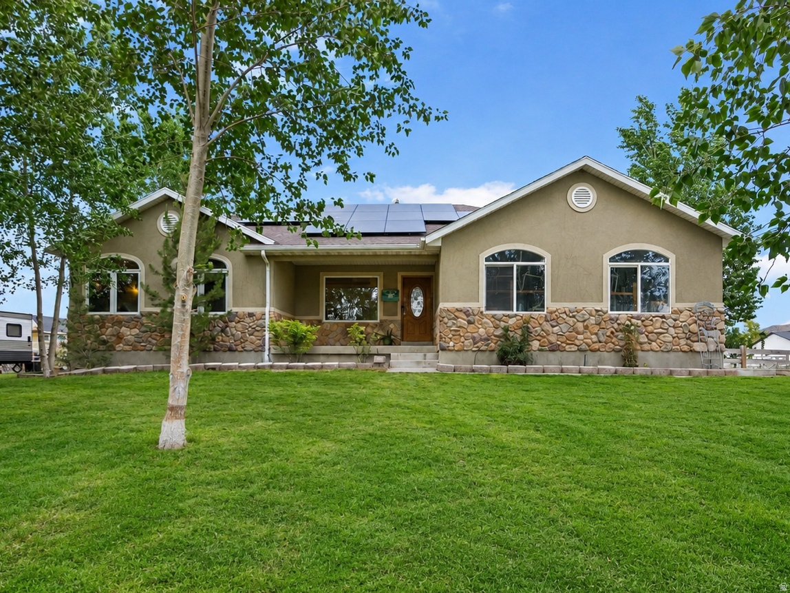 Spacious 5-Bedroom Rambler on Over an Acre. Discover comfort, space, and endless possibilities in this beautifully designed 5-bedroom, 3-bath home featuring an open floor plan perfect for everyday living and entertaining. From the inviting entryway to the expansive living area and well-appointed kitchen, you'll feel right at home the moment you walk in. With 75% of the basement already finished, the remaining 25% offers a blank canvas ready to match your vision-whether it's a home theater, gym, additional bedrooms, or even an accessory dwelling unit (ADU). The flexibility is yours! Outside, enjoy over an acre of land with mature trees, animal rights and your very own sport court-ideal for basketball, or active play year-round. This property offers the rare opportunity to enjoy space, privacy, and potential for hobby farming or equestrian use. Whether you're seeking a multi-functional home or room to grow, this one checks all the boxes. Don't miss this opportunity to own a home where lifestyle meets potential-schedule your private tour today!  Square footage figures are provided as a courtesy estimate only and were obtained from County Records. Buyer is advised to obtain an independent measurement.
