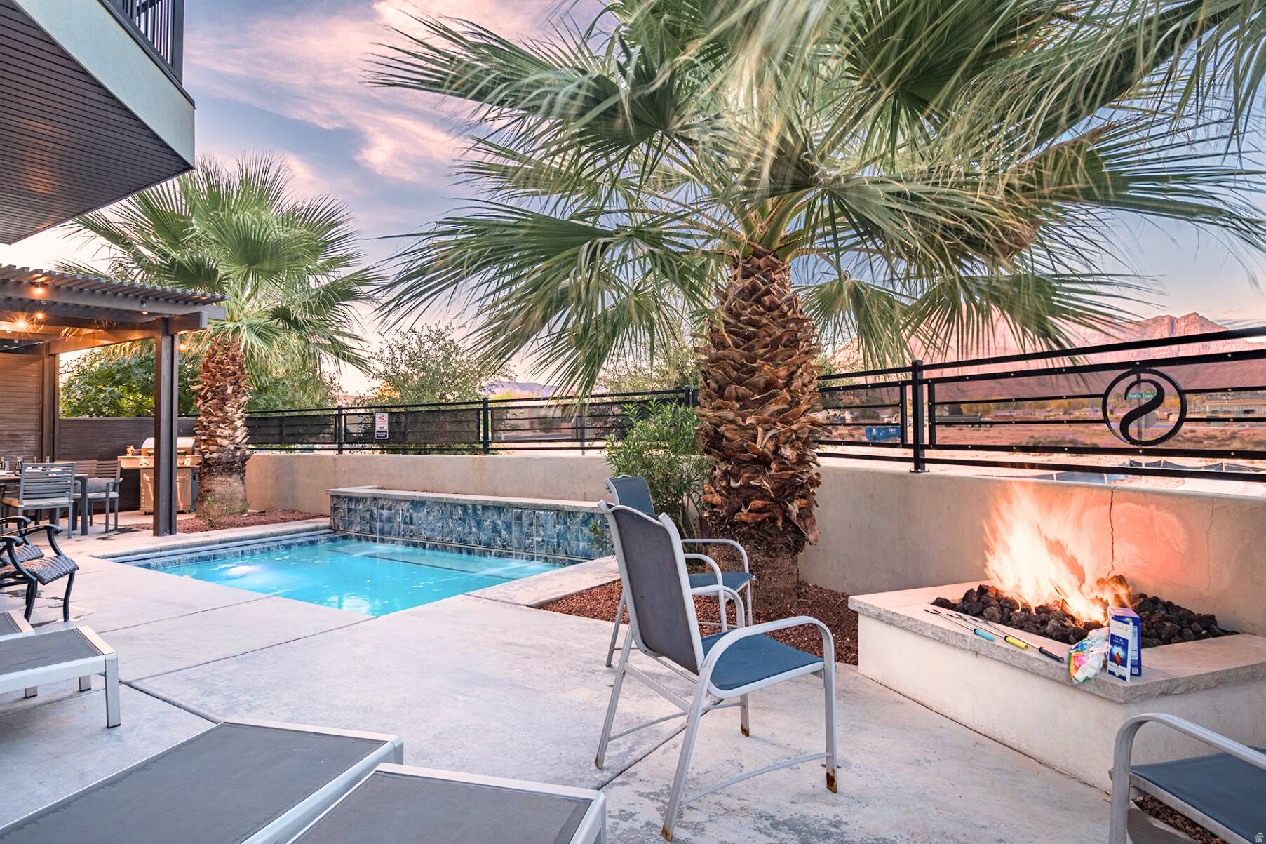 One of the highest grossing 5 bed vacation rental in all of Santa Clara and especially Ocotillo Springs. Very well Located close to trails, Harmons, Gubler Park & just 10 minutes from down town St. George, Snow Canyon State Park and Tuacahn Amphitheater! Fully furnished 5-bedroom, 6-bathroom nightly rental designed for relaxation and luxury. Unique floor plan with beautiful decor & furniture designed by 1of the best vacation rental designers in Utah. Enjoy the serenity in the back yard with 3 Palm trees, firepit and a private pool & separate spa. Enjoy the Big deck upstairs with breathtaking views of the Red Mountains by day & the stars at night w/another firepit. End unit & convenient access in & out as well as close proximity to all the community amenities. Ocotillo includes: a beautiful resort pool w/ cascading waterfalls & slide, a custom splash pad, huge hot tub, fantastic clubhouse w/full kitchen, full gym, game rm w/pool & ping pong, 2 bathrooms, dining and gathering areas to enjoy the fire pit & BBQ area & 2 pickleball courts with plenty of extra parking.