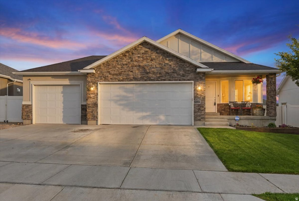 This rambler is better than new with it's upgraded features.  Fully fenced and landscaped yard, all in a lovely neighborhood close to schools, shopping, and so much more! 30 minutes to the Salt Lake Airport, and just a bit further to downtown Salt Lake City. Insulated garage doors, oversized pantry, security system, natural gas stubbed for BBQ, and a covered patio with so much more to fall in love with! This home has been well maintained and is ready for you!