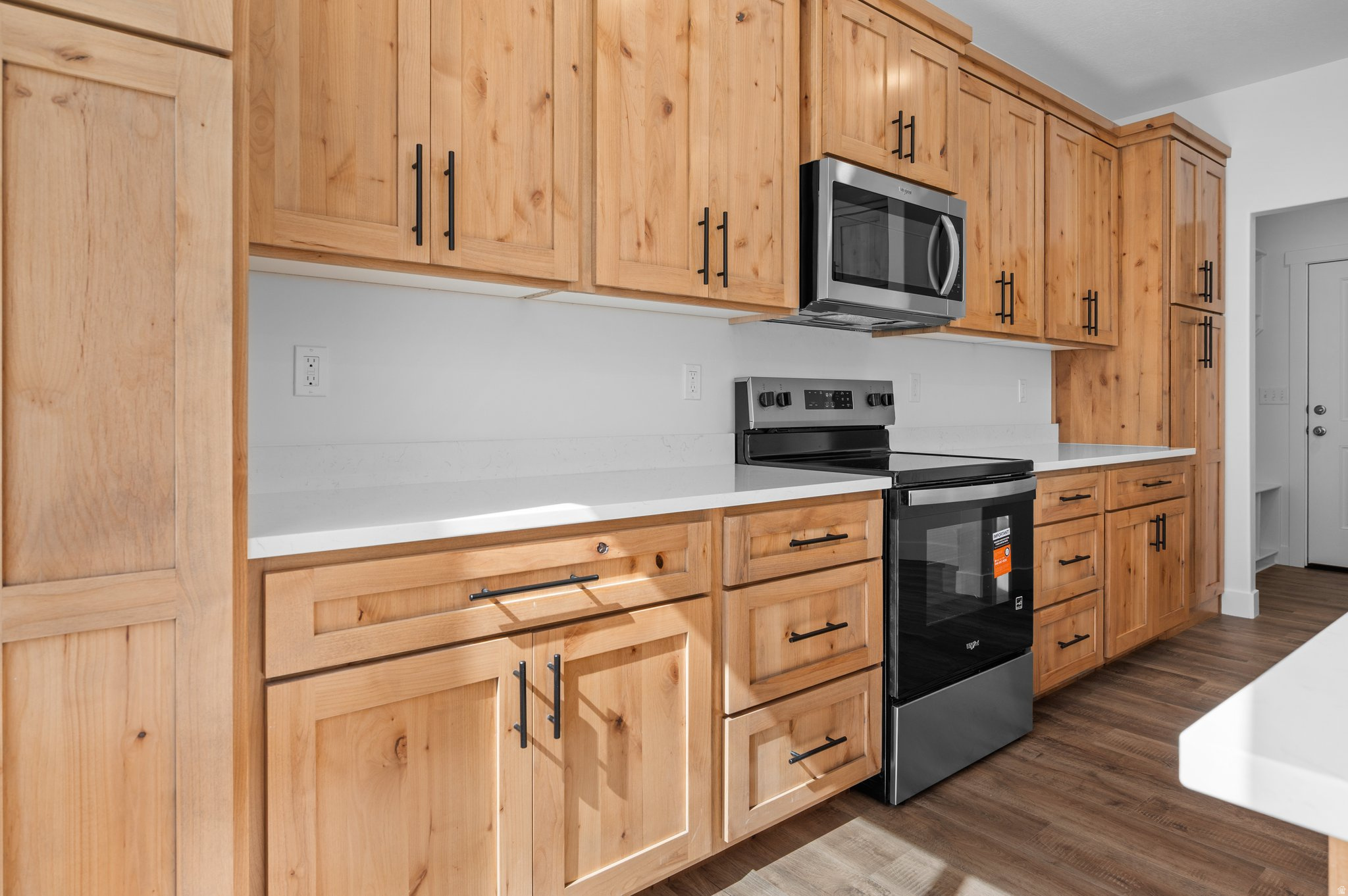 Welcome to Midland Square Townhomes in Roy! These BRAND-NEW 3-bedroom, 2.5 bathroom, townhomes feature 9' ceilings on the main level, granite or quartz countertops, soft-close cabinets, a spacious walk-in pantry with an outlet for appliances, ceiling fan in the living room, abundant kitchen storage and counter work space, LPV throughout main floor, under the stairs storage along with two linen closets upstairs, mudroom area, and 2-car garages. Partially fenced backyard spaces provide added privacy and functionality. The generously sized primary bedrooms include a walk-in closet, ceiling fan, with select homes offering double vanities and large showers, while others feature single vanities with separate tub/shower combinations. Choose from floor plans with unfinished basements for future growth OR options without basements to fit your needs. Enjoy convenient access to shopping, dining, schools, parks, and the FrontRunner. Midland Square offers comfortable, low-maintenance living in a welcoming, community-focused neighborhood.**The photos may NOT be representative of this exact home**