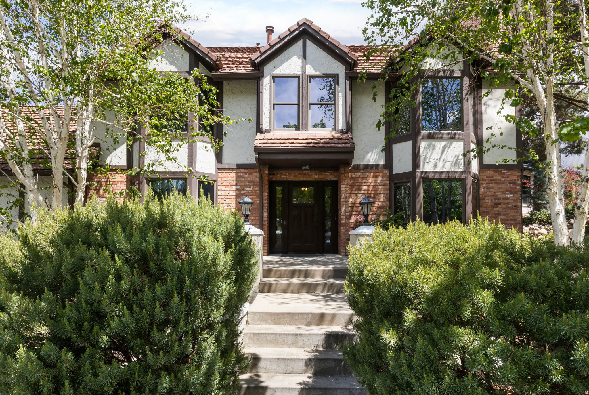 Nestled in one of Utah's best-kept secret neighborhoods, this stunning mountain retreat offers the perfect balance of adventure, privacy, and convenience. Located under 30 minutes from four world-class ski resorts and only 45 minutes from all six major resorts, this home places year-round recreation right outside your door. Enjoy direct access to endless hiking trails, mountain biking, backcountry terrain, and the breathtaking beauty of Big Cottonwood Canyon. Whether you're chasing powder days, summer hiking, or peaceful alpine mornings, the outdoor lifestyle here is truly unmatched.  Inside, the home is equally captivating. A spectacular atrium filled with natural light creates a seamless connection to the surrounding mountains, offering panoramic views in every season. Thoughtfully designed living spaces blend warmth, comfort, and architectural character, making the home feel both luxurious and inviting. Despite its secluded mountain feel, you're still just minutes from grocery stores, restaurants, coffee shops, and everyday conveniences. This rare combination of accessibility and outdoor immersion makes the neighborhood a hidden gem unlike anywhere else along the Wasatch Front. If you've been searching for a home that delivers adventure, serenity, and unforgettable views all in one place - this is it.