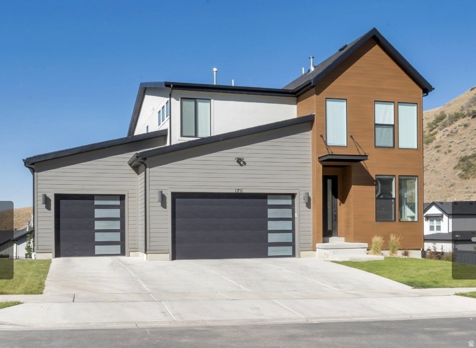 PRICED TO SELL! Welcome home to one of the most desirable corner lots in the highly sought-after Canyon Point neighborhood on Traverse Mountain. This 2025 build offers 3,618 square feet of living space across 4 bedrooms and 4 baths, including a fully finished basement, 3-car garage, paid-off solar and brand-new completed backyard landscaping. The kitchen features beautiful two tone HDF soft-close cabinets, gourmet KitchenAid appliances including double ovens, 5 burner gas cooktop with stainless steel vented hood, stunning tile backsplash to the ceiling, quartz counters with thick 6cm edge, 2-story fireplace, mudroom bench, huge deck with views of the valley below, and LVP flooring throughout the entire main level & master bedroom. Outside, the lifestyle is just as strong as the home itself. You're just 800 feet from a trailhead - mountain biking and hiking right out your door - and only 2 miles from the Traverse Mountain Outlet Mall. Canyon Point residents also enjoy a luxury clubhouse, beach-entry pool with lap lanes, pickleball and basketball courts, multiple parks, and close proximity to freeway access. The neighborhood, yet peaceful and quiet, is full of families and kids, making it an easy, welcoming place to settle in. What truly sets this home apart is its setting: soaring two-story windows flood the space with natural light and frame sweeping mountain views from nearly every angle, with stunning sunsets to top it off. View wildlife from the comfort of your couch! Add in the fully completed landscaping and included window coverings, and you're getting a home that's move-in ready today. No showings until Thursday, July 16.