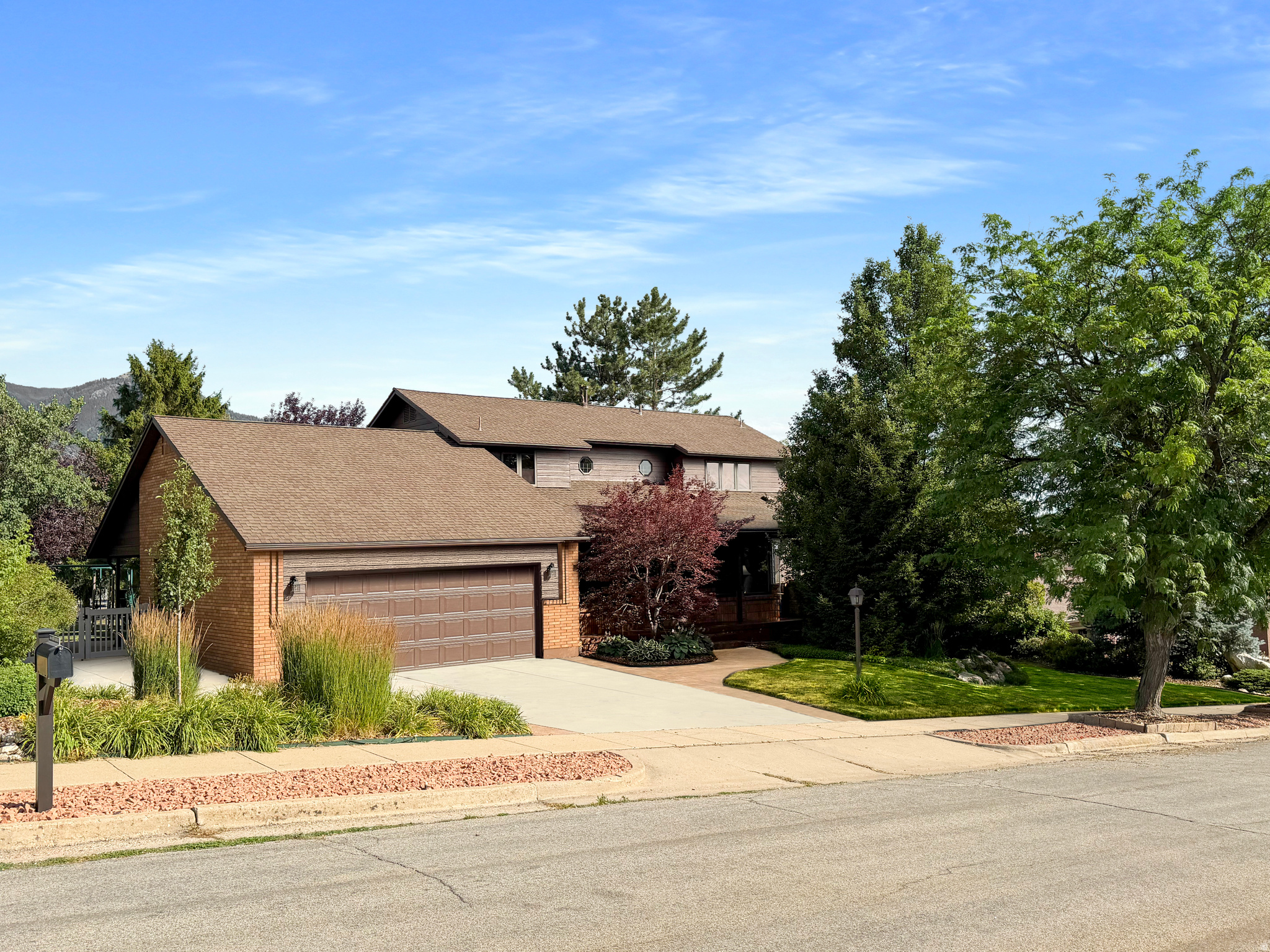 Welcome to this timeless home in the highly desirable Lakeview Heights community, lovingly maintained by the same owner for the past 39 years. From its thoughtful layout to its beautifully cared-for grounds, this home reflects pride of ownership at every turn.  Step inside to find a spacious main floor featuring a large primary suite, a dedicated office or den, and a formal dining room that flows seamlessly into the kitchen. The bright kitchen and adjoining dining area overlook the backyard and open onto a charming patio shaded by a beautiful wooden arbor and mature trees-creating the perfect setting for morning coffee, summer evenings, or entertaining family and friends.  Upstairs, you'll find three additional bedrooms, a versatile loft, and a full bathroom, providing plenty of room for family, guests, or hobbies.  The expansive basement offers endless possibilities with abundant storage and living space, along with the potential to create a future mother-in-law apartment thanks to its separate entrance.  Outside, enjoy a private backyard that backs to the beautifully maintained Lakeview Heights common grounds, offering a peaceful setting with no direct rear neighbors. Take in stunning views of Ben Lomond Peak from the front porch and enjoy breathtaking sunset evenings from the backyard patio.  Ideally located just minutes from North Ogden shopping, restaurants, and recreation, this home also offers quick access to several trailheads within the Bonneville Shoreline Trail system. The Lakeview Heights HOA enhances the lifestyle with beautifully maintained common areas, walking paths, a playground, picnic area, regular community activities, and cable and internet included.  This is a rare opportunity to own a truly cherished home in one of North Ogden's most established and sought-after neighborhoods.