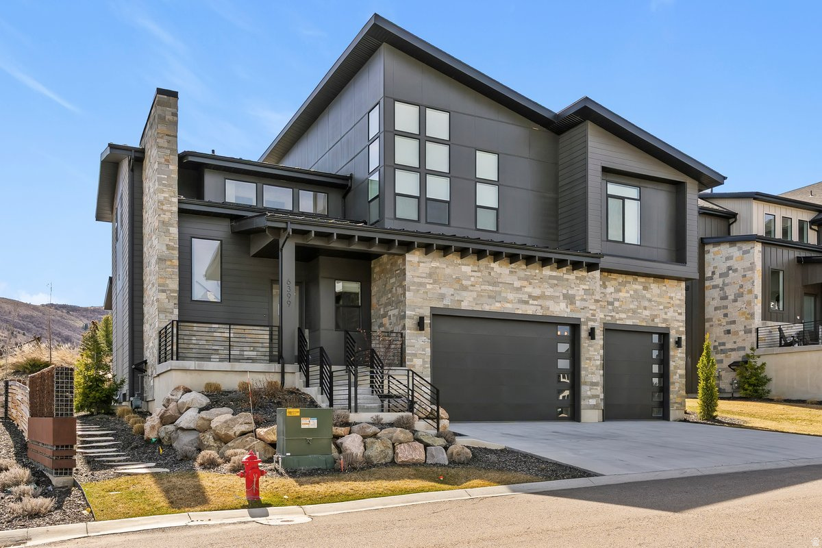 The absolute nicest home in Huntsville at this price. Unbelievable opportunity!  Featured in the 2023 Parade of Homes, this stunning modern home offers the perfect blend of luxury living and investment potential with long rental approval. Ideally located near Pineview Reservoir and just minutes to Snowbasin Resort, this property is perfect for year-round recreation including boating, skiing, hiking, and biking. The home features bright, open living spaces with expansive windows, seamless indoor/outdoor living with large sliding doors, and elevated finishes including chef-grade appliances. Fully landscaped with HOA-covered yard maintenance and snow removal for easy, low-maintenance living. A rare opportunity for a vacation home, primary residence, or income-producing property in one of Northern Utah's most sought-after recreational areas.