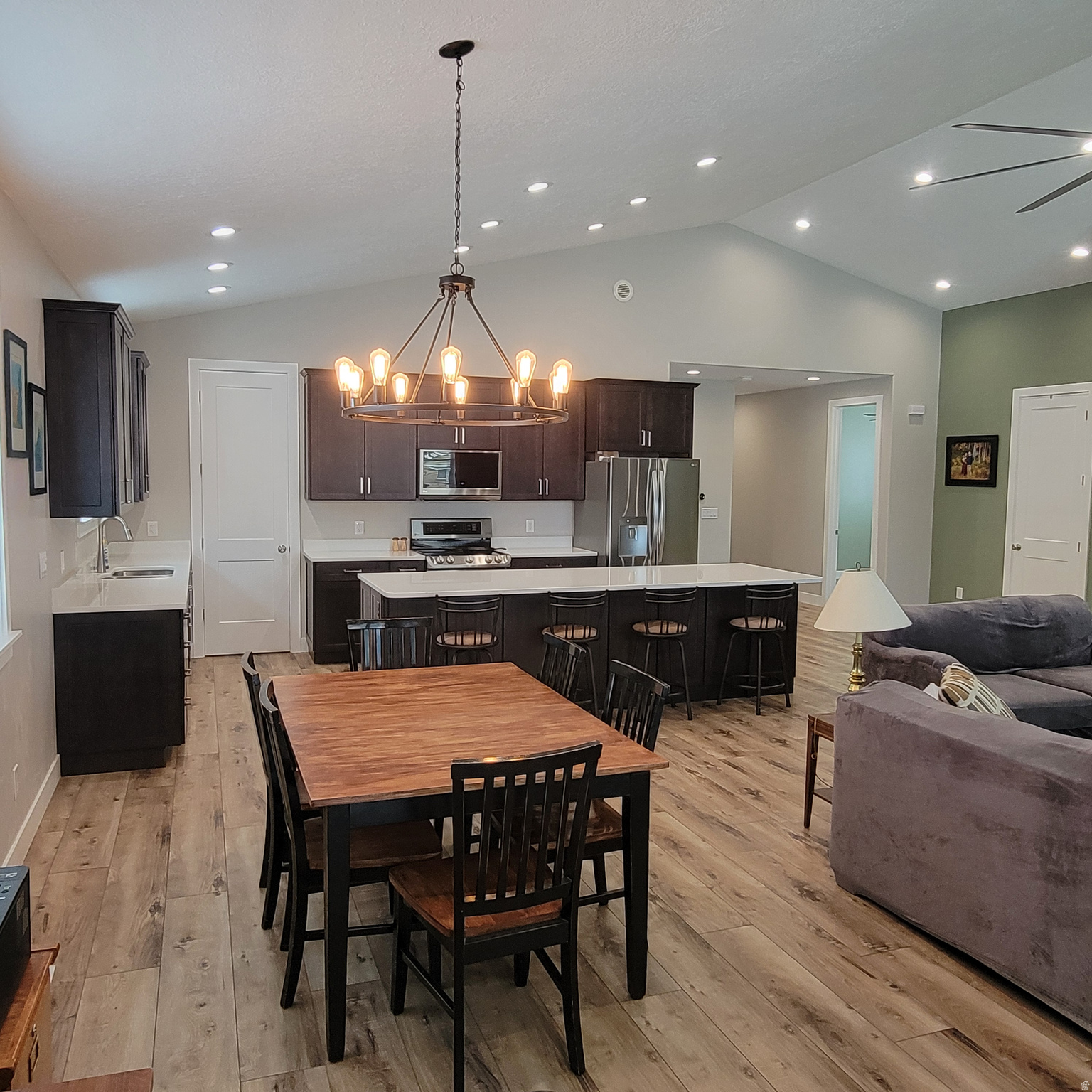 Builder quality. Move-in ready. No waiting. Completed and issued a Certificate of Occupancy in 2024, this move-in ready 5-bedroom rambler offers over 3,800 square feet of thoughtfully designed living space, including a fully finished basement, in a quiet Washington Terrace cul-de-sac with mountain views. Offered at approximately $157 per square foot, this home presents exceptional value compared to many newer construction options. Unlike many new construction homes in this price range, this home is already complete, fully finished, landscaped, and ready to enjoy from day one. Built for comfort, efficiency, and everyday living, this home combines modern construction with the upgrades buyers want. The open, light-filled main level features a spacious great room with approximately 14-foot peak ceilings, a well-appointed kitchen with quartz countertops, and a massive 10-foot island ideal for gathering, entertaining, and daily life.  The fully finished basement with 8-foot ceilings is ideal for additional living space, a home office, gym, hobbies, or multi-generational living. Built for lasting comfort and efficiency, a tight building envelope, Energy Recovery Ventilation (ERV) system, and high-efficiency dual-zone furnace and A/C help maintain consistent temperatures while reducing energy costs. The oversized garage includes an extended bay perfect for trucks, storage, recreation equipment, or workshop space. Outside, the yard is largely finished and ready to enjoy while still allowing opportunities to personalize select areas to your preferences.  Why wait months for new construction when this home is already complete? Enjoy modern systems, quality finishes, a finished basement, and move-in readiness today. Conveniently located near schools, shopping, recreation, and commuter routes.  Equal Housing Opportunity