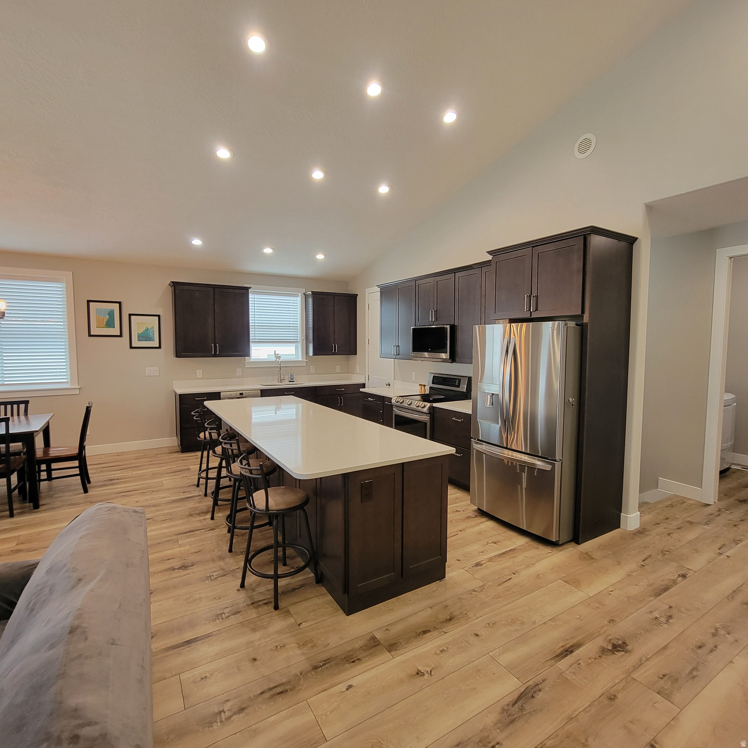 Better than new and move-in ready without the wait.  Completed in 2024, this beautifully finished rambler offers over 3,800 sq ft of thoughtfully designed living space with the upgrades today's buyers actually want. From the moment you step inside, you'll notice the difference: an open, light-filled layout, quality finishes throughout, and a home that feels solid, efficient, and comfortable year-round.  The main level features a spacious great room (approximately 14' high peak), a well-appointed kitchen with quartz countertops, giant island (10' x 3 1/2') and a functional layout perfect for both everyday living and entertaining. The finished basement adds incredible flexibility with additional bedrooms, a large living area, and space for a home gym, office, or hobbies.  What truly sets this home apart is its efficiency and comfort. Built with a tight building envelope, an energy recovery ventilation (ERV) system, and a high-efficiency dual-zone furnace and A/C system, you'll enjoy consistent temperatures on both levels and lower utility costs compared to typical homes.  The oversized garage is another standout feature, offering an extended bay ideal for trucks, extra storage, or workspace.  Outside, the yard is mostly finished and ready to enjoy, with just minor areas left for you to customize to your taste, giving you the benefits of a finished yard without paying a premium for someone else's design choices.  Currently no HOA. However, an HOA is being formed for the community and homeowner will be required to join. Full details To Be Determined. Please contact agent with any questions.  Why wait or pay extra for a new build when this home already includes the upgrades, finished basement with 8' high ceilings, and move-in readiness you're looking for!  Located in a quiet, established neighborhood with convenient access to shopping, schools, and commuter routes, this home offers the perfect balance of comfort, efficiency, and value.  Come see the difference for yourself.  Equal Housing Opportunity