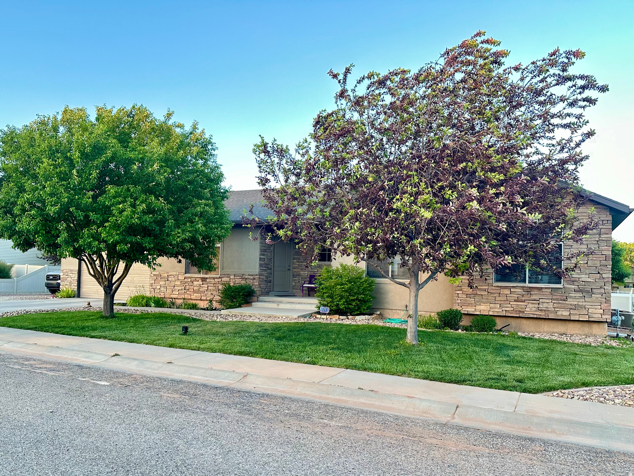Living is easy in this spacious home and quiet and friendly neighborhood. Stay active with a park and walking trail close by. Fully landscaped yard offers shade in the evening with space to grill and chill. Garden spot with established raspberries and apricot tree. Basement is perfect for guests, kids, or grandkids with spacious bedrooms and a bathroom. Basement family room has room for a pool table or exercise equipment and is plumbed and wired for a future kitchenette. Main level has large, open floor plan for entertaining and relaxing. Laundry is also on main floor. Simple and easy floor plan that is understated and beautiful as is, or ready for your personal touches and style. This home has tons of storage with an ample 2 car garage with built-in shelving.  To top it all off, there is a large detached shop big enough for an RV, toys, and hobbies. The shop is wired with a 220 plug and has built-in shelving. Schedule your showing today!