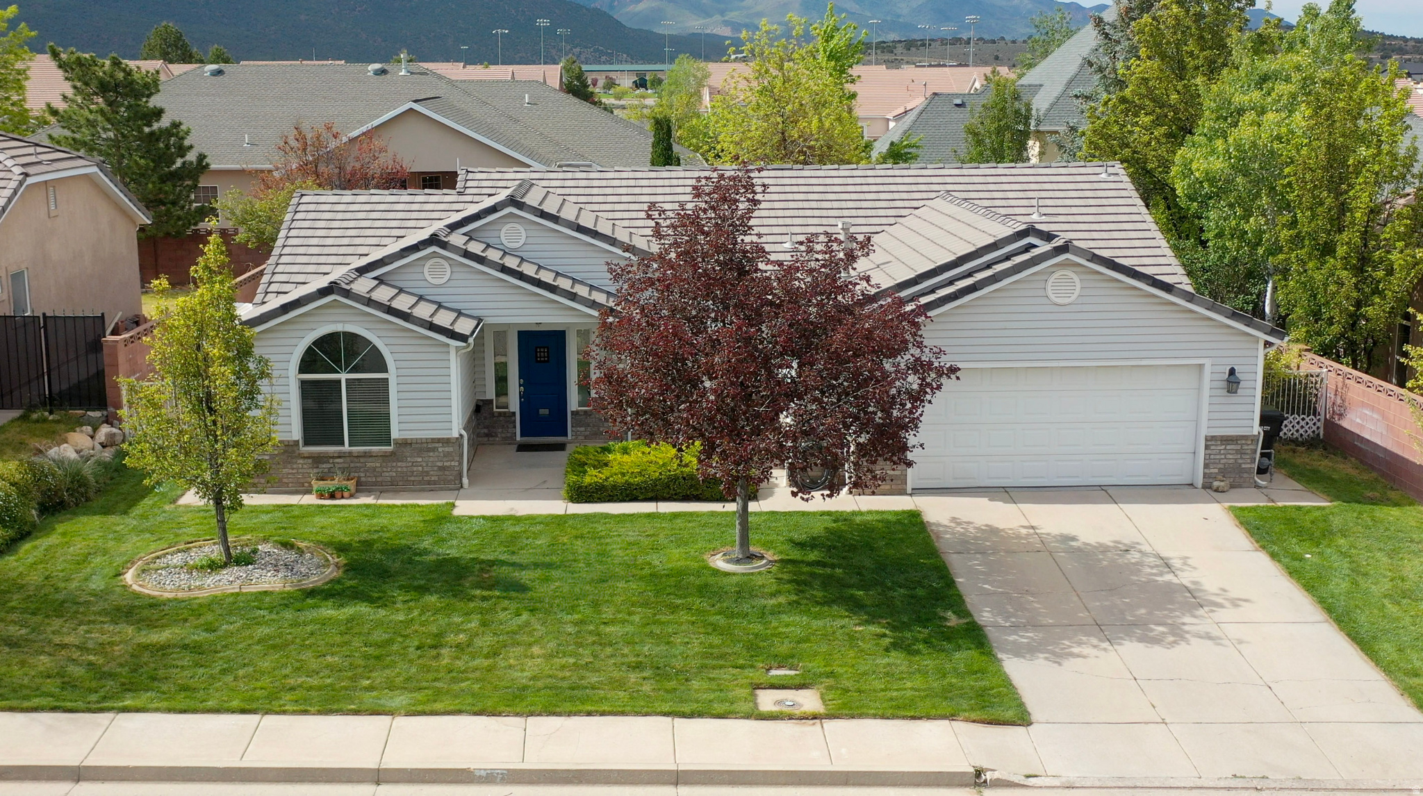 Location truly sets this property apart. Situated in a sought-after neighborhood, this home offers both convenience and a quiet setting away from busy roads and unnecessary traffic. The interior has a blend of luxury vinyl and hardwood flooring, along with an updated kitchen featuring granite countertops, stainless steel appliances, and an adjacent dining area surrounded by windows. The fully fenced and landscaped yard includes a covered patio, creating a comfortable outdoor space to relax or host guests. Thick grass and garden areas surround the house. Enjoy close proximity to baseball fields, community parks, the aquatic center, and Lake at the Hills, along with easy access to nearby walking trails--making this home ideal for those who value both comfort and an active lifestyle.