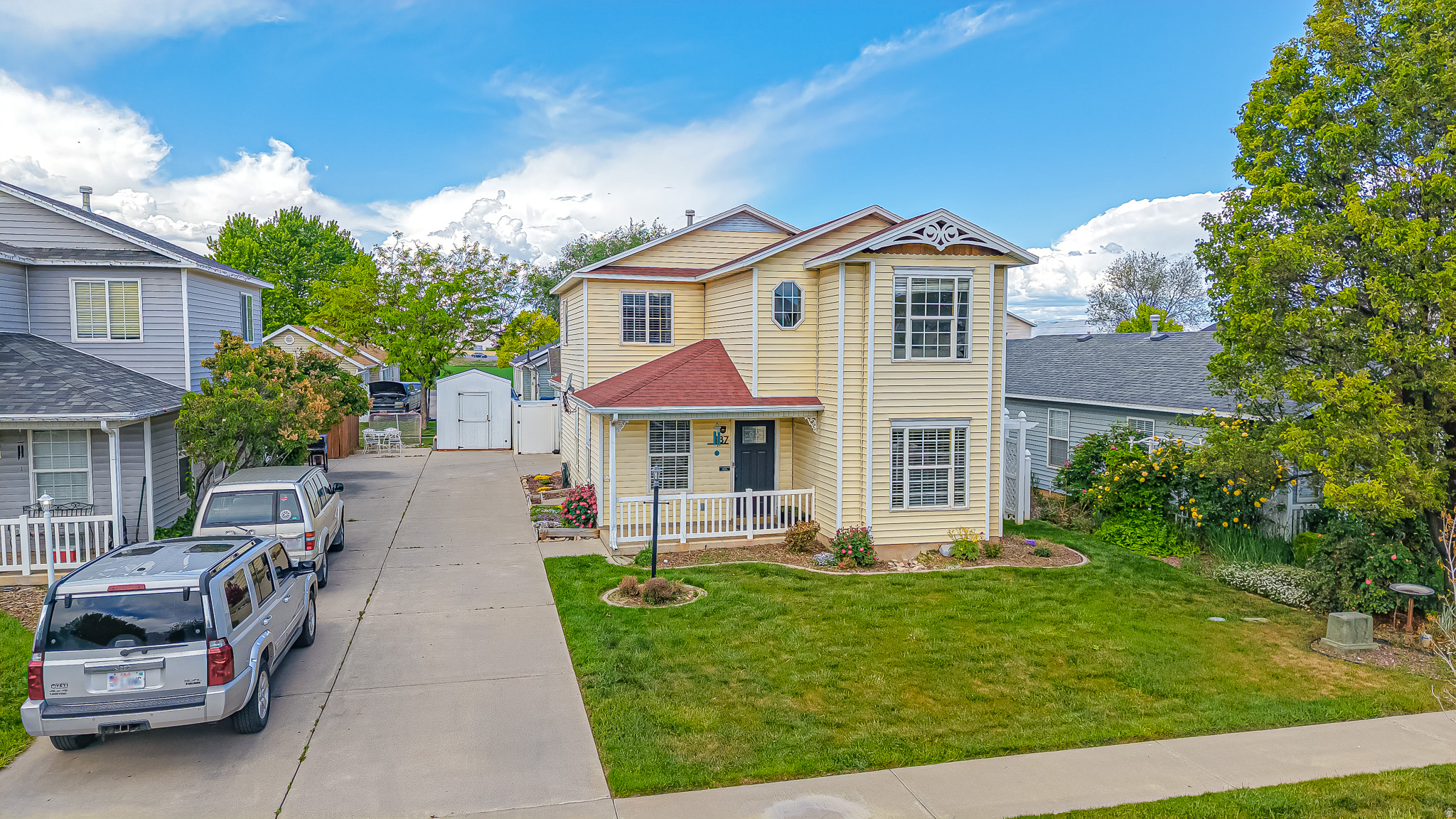 *****NOTE: Be sure to check out the virtual tour by clicking on the tour button*****. Wake up to golden morning light streaming through east-facing windows as the sunrise fills every room with a warm, natural glow. This charming and yellow 4-bedroom, 2.5-bathroom home is perfectly positioned to make the most of Utah's stunning scenery including peaceful mountain views right from the master bedroom.  The main level impresses with durable luxury vinyl plank flooring and updated lighting throughout, creating a bright, modern feel from the moment you walk in. Whether you're entertaining or simply enjoying a quiet evening, the thoughtful finishes give the space an inviting, move-in-ready appeal.  All four bedrooms are located on the second floor, offering a clean separation between living and sleeping spaces. The fully fenced yard sits on a 0.10-acre lot. A manageable, low-maintenance outdoor space perfect for small children or weekend gatherings and/or light gardening. The side yard on the north side of the house has a small gated area for pets to have their own space so you don't have any surprises for your guests. The two-car sideload garage, tucked at the back of the home on a shared driveway, keeps the front elevation clean and adds great curb appeal.  Located in the heart of Spanish Fork, you're minutes from local parks, directly west of Spanish Fork High School. So if Friday night lights are your thing, this is your place. Also close to dining, and everything this growing Utah County community has to offer.  Don't miss your chance to own this quiet place where every morning feels like a fresh start.   Square footage figures are provided as a courtesy estimate only and were obtained from County records.  Buyer is advised to obtain an independent measurement.