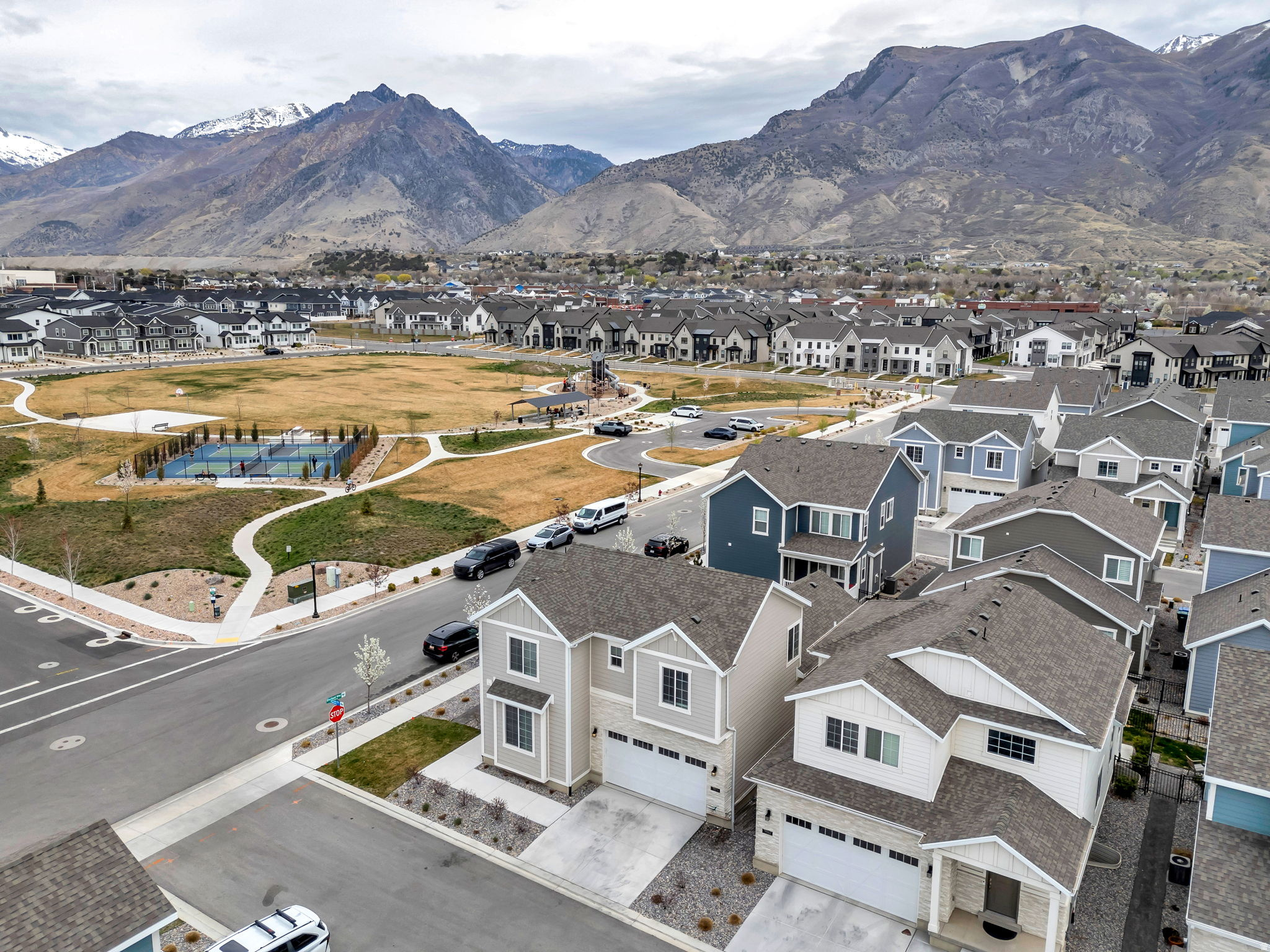 NEW PRICE! Situated in one of Utah County's most sought-after communities, Highland, and within the boundaries of Lone Peak High School, this beautifully crafted Ivory Home is designed for those ready to simplify without giving up space or style. The main level offers true single level living, including a dedicated office and a spacious primary suite, allowing for comfort and convenience in everyday life. At the heart of the home, the expansive gathering space creates the perfect setting to host family when they come to town, with an open layout that feels both elevated and welcoming. Additional bedrooms provide flexibility for guests, hobbies, or extended stays, making it easy to accommodate the moments that matter most. Located next to a beautifully maintained 5-acre community park with pickleball courts, the home offers access to outdoor space while still enjoying a peaceful. 220v wired in garage for electric vehicle.  The HOA handles all landscaping, delivering a lock-and-leave, low-maintenance lifestyle so you can focus more on time with family, travel, and enjoying the surrounding area. If you've been looking for a home that allows you to downsize your responsibilities while keeping the space you need to gather, host, and enjoy life, this is a rare opportunity in Highland. Make sure to click Tours for 3D and video walk throughs.
