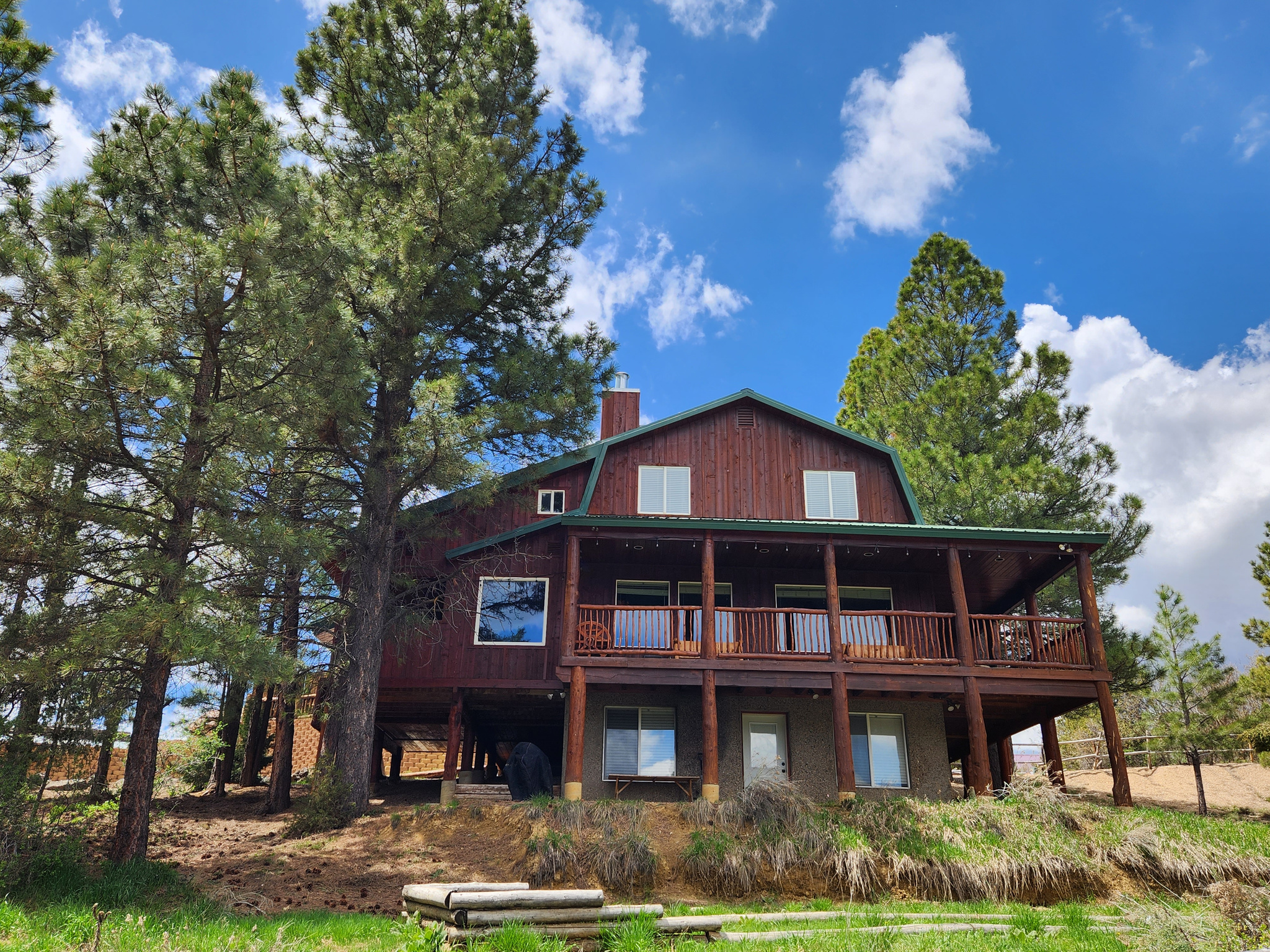 Step into a mountain retreat that blends comfort, charm, and incredible space. This beautiful cabin offers 7 bedrooms and 5 baths, giving everyone plenty of room to spread out and enjoy the surroundings. From the moment you arrive, the sweeping mountain views-framed perfectly from the broad, covered decks-set the tone for relaxation. The main-level suite provides easy living, complete with its own office and an airy loft that can flex to your needs. The kitchen has been thoughtfully refreshed with stylish new countertops, modern luxury vinyl flooring, and plush new carpet adds warmth throughout. Outdoors, the property shines as a gathering place. Spend your afternoons around the fire pit, enjoy a friendly game of horseshoes, or unwind in the hot tub under the stars. The generous decks invite summer lounging, while the wood-burning fireplace creates the coziest winter escape. This cabin is offered fully furnished with a compelling offer, making it truly move-in ready. For those eyeing investment potential, its 7yr history as a short-term rental speaks for itself-with an impressive collection of more than 150 positive reviews. A perfect 2nd home or an investment! Buyer to verify all.