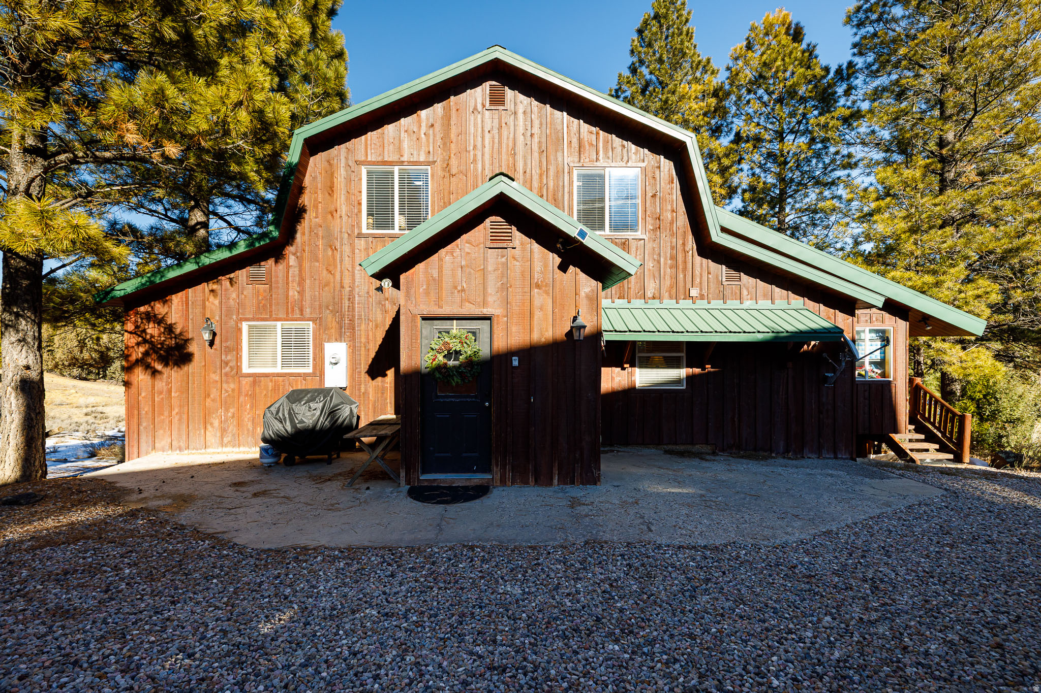 Step into a mountain retreat that blends comfort, charm, and incredible space. This beautiful cabin offers 7 bedrooms and 5 baths, giving everyone plenty of room to spread out and enjoy the surroundings. From the moment you arrive, the sweeping mountain views-framed perfectly from the broad, covered decks-set the tone for relaxation. The main-level suite provides easy living, complete with its own office and an airy loft that can flex to your needs. The kitchen has been thoughtfully refreshed with stylish new countertops, modern luxury vinyl flooring, and plush new carpet adds warmth throughout. Outdoors, the property shines as a gathering place. Spend your afternoons around the fire pit, enjoy a friendly game of horseshoes, or unwind in the hot tub under the stars. The generous decks invite summer lounging, while the wood-burning fireplace creates the coziest winter escape. This cabin is offered fully furnished with a compelling offer, making it truly move-in ready. For those eyeing investment potential, its 7yr history as a short-term rental speaks for itself-with an impressive collection of more than 150 positive reviews. A perfect 2nd home or an investment! Buyer to verify all.