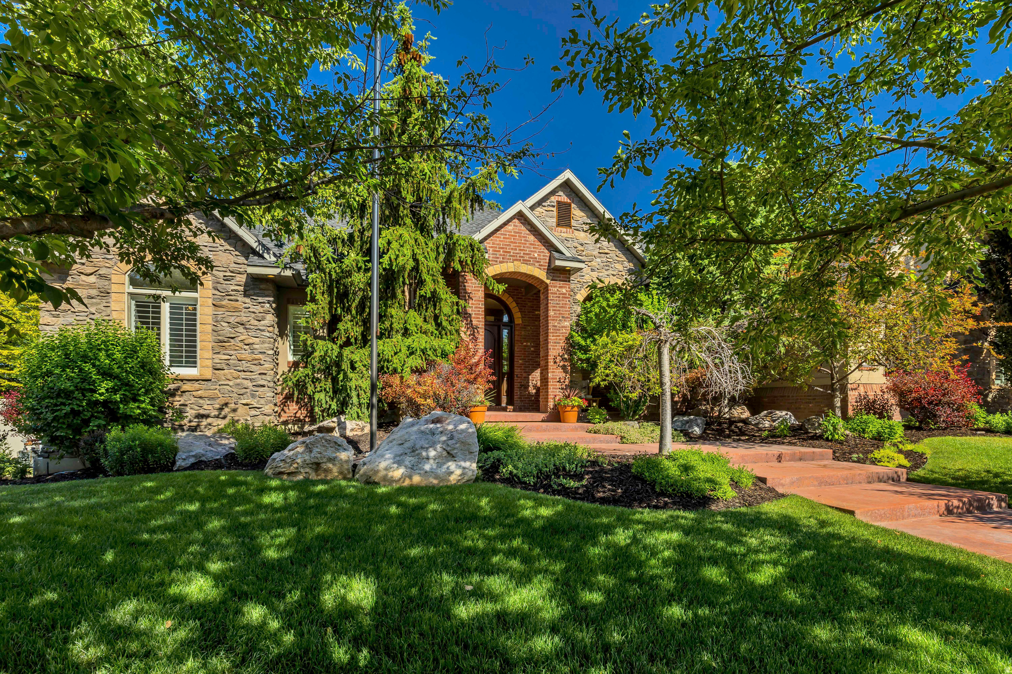 Every once in a while, a home comes along that offers more than just a place to live, it offers a lifestyle. Nestled in a quiet cul-de-sac in west Kaysville in the highly sought after Mountain Vistas Neighborhood, this beautifully updated home backs directly to a large grassy commons area and walking path, creating a sense of privacy, space, and connection to the outdoors that is hard to find. Designed for both everyday living and unforgettable entertaining, the backyard is a true retreat featuring a sparkling pool, cozy fire pit, and a professional-quality pickleball/basketball court installed in 2022. Whether you're hosting summer gatherings, enjoying family game nights, or relaxing under the stars, this outdoor space was built to be enjoyed. Inside, the home offers generous living spaces and thoughtful upgrades throughout. The gourmet kitchen is a chef's dream, featuring a Viking professional double-oven range with six burners and a griddle, perfect for preparing everything from weeknight dinners to holiday feasts. The recently updated main floor showcases fresh finishes and modern touches, while much of the basement has been newly painted. Entertainment and wellness enthusiasts will love the dedicated theater room and private workout room, creating the ultimate at-home experience. The basement also offers more than 750 square feet of additional storage space. Technology and convenience come together with a Control 4 home automation system that integrates lighting, entertainment, climate, security, and communications. New owners have the opportunity to further modernize and expand the system to suit their needs. This south-facing property is ideally located near parks, trails, shopping, freeway access, and TRAX, offering both convenience and recreation right at your doorstep.  Over the past five years, the current owners have invested more than $150,000 in renovations and improvements, including a new roof installed in 2023 with premium 50-year shingles, providing lasting value and peace of mind. This is more than a home, it's a place to gather, play, entertain, and create lasting memories. Square footage figures are provided as a courtesy estimate only and were obtained from county records. Buyer is advised to obtain an independent measurement.