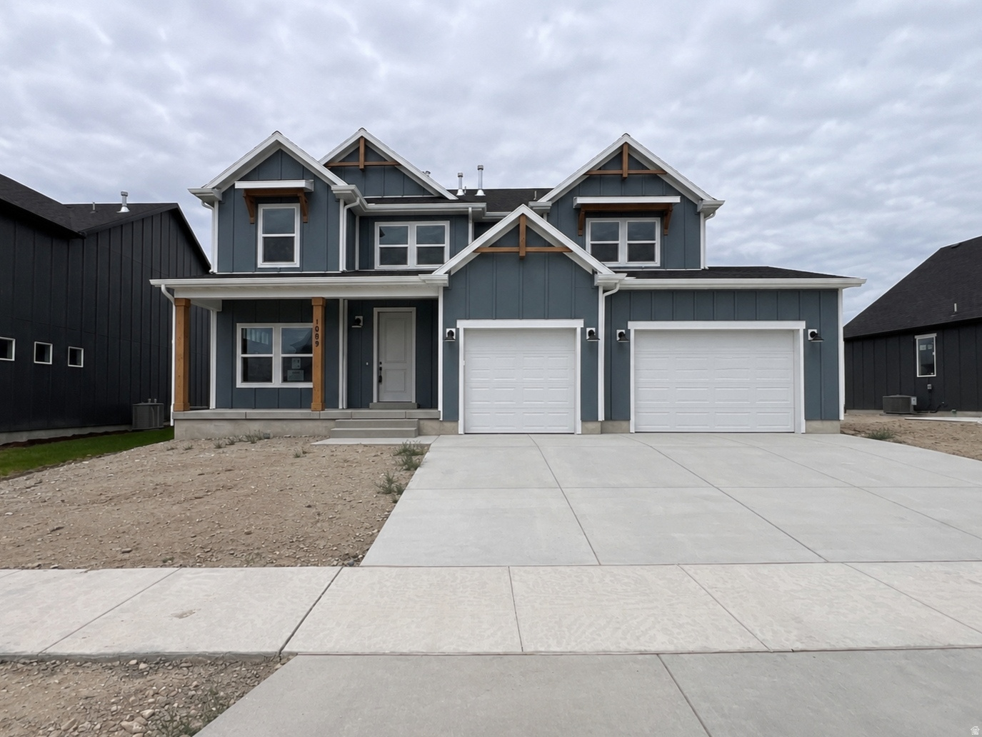 **HUGE PRICE DROP** Don't miss this beautifully upgraded home, loaded with over $140,000 in options! The gourmet kitchen shines with quartz countertops, a stylish backsplash, and upgraded cabinets. Enjoy 9' ceilings on the main, a farmhouse elevation, and classy gold fixtures throughout. LVP flooring flows across the main floor, complemented by upgraded carpet and LVP finishes. The fully finished basement adds even more living space, plus a 3rd car garage for extra storage. Take in gorgeous mountain views from a quiet, desirable community close to restaurants, shopping, and schools. Front and side-to-back yard landscaping is included and will be completed next month. Community amenities include a pool, clubhouse, playground, fitness center, and high-speed internet. Completion July 2026