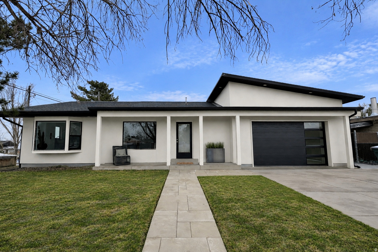 This recently renovated home offers a fresh, modern feel with everything completely new, from the interior updates to the outdoor space. The open floor plan features large windows that flood the home with natural light, creating a bright and inviting atmosphere. The home includes five bedrooms and two full bathrooms, both with double sinks, providing plenty of space and convenience. The kitchen and bathrooms are finished with sleek quartz countertops. The property also includes a brand-new yard with a sprinkler system, a cozy firepit area, and a fully fenced yard for privacy and security. Inside, you'll find a tankless water heater, a new furnace, and new central air conditioning, ensuring comfort and efficiency year-round. The basement is plumbed and ready for a kitchen, making it easy to turn into a mother-in-law suite or additional living space. Located in a great area, this home combines stylish design with convenience, making it a perfect place to call home.  Schedule your showing today!