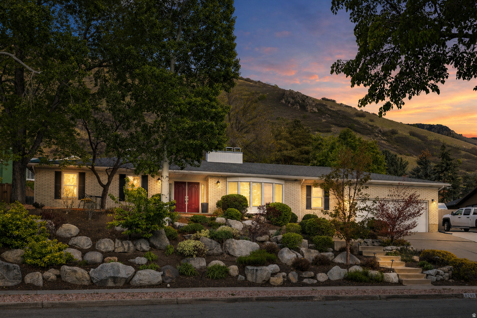 New roof being installed June 11th.  The wait is over... this beautiful home is tucked just below Top of the World Drive in the foothills of Cottonwood Heights, this residence is set within one of the area's most established and consistently sought-after neighborhoods, where mature trees, well-kept homes, and a sense of quiet permanence define the setting. Spanning 4,610 square feet with 5 bedrooms and 4 bathrooms, the home offers a thoughtful balance of openness and definition. The main level is designed for both gathering and everyday living, with a seamless connection between the kitchen, dining, and family spaces, complemented by formal living and dining rooms that add a layer of refinement and flexibility. The upper level is anchored by a spacious primary suite that feels both private and comfortable, along with an additional bedroom, full bathroom, and a dedicated office space suited for modern living. On the lower level, generous living and flex spaces create opportunities for recreation, fitness, or hosting, with 3 additional bedrooms and a full bathroom providing functionality for a variety of needs. Outdoors, the .27 acre lot is framed by mature landscaping, creating a private, tree-lined backdrop. The patio is ideally positioned beneath a canopy of established trees, offering a setting that is equally suited for entertaining or quiet retreat. Recent improvements, including a newer furnace and AC and updated kitchen appliances, add a level of ease and confidence to the home. Positioned between Big and Little Cottonwood Canyons, this location offers immediate access to world-class skiing, hiking, and year-round outdoor recreation. It is a rare combination of refined neighborhood living and proximity to the Wasatch Mountains that continues to define Cottonwood Heights as one of the valley's most desirable places to call home.