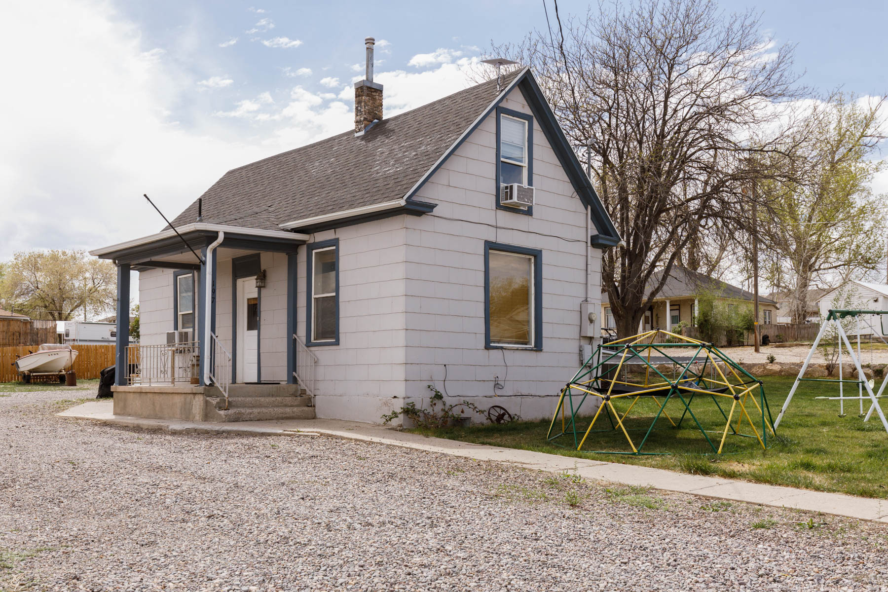 Price Reduced! Motivated Seller! This 4 bed, 1 bath home sits on .32 acre corner lot and features a new roof and new rooftop A/C. Enjoy plenty of parking for RV'S, trailers, and all your toys, plus a sprinkler system to keep the yard looking great.  Buyer is advised to obtain an independent measurement.