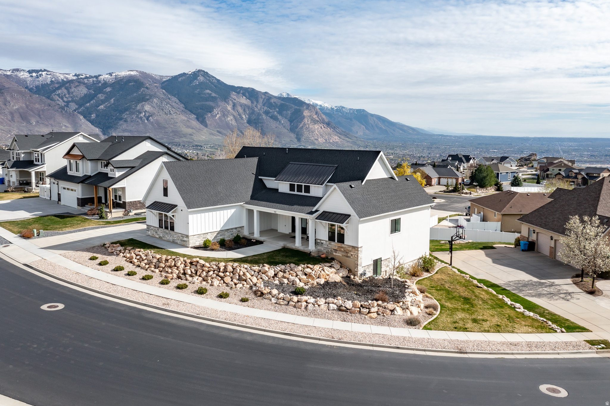 Upper bench North Ogden home with unobstructed valley views and mountain access. Bright, open interior with large windows throughout. Gorgeous chef's kitchen - including butler's pantry with extended cabinetry and prep space! Primary suite with access to the covered deck All bedrooms include walk-in closets and attached baths (upstairs two beds share a bath). Lower level has been finished to match the quality and style of the rest of the home, featuring a sunny great room, offering a kitchenette with luxury appliances and custom cabinetry. West property line provides space for additional parking pad. Ideal for buyers with an eye for quality, looking for a new house that is finished and ready for a new owner! *Furniture was selected for the home and is negotiable.