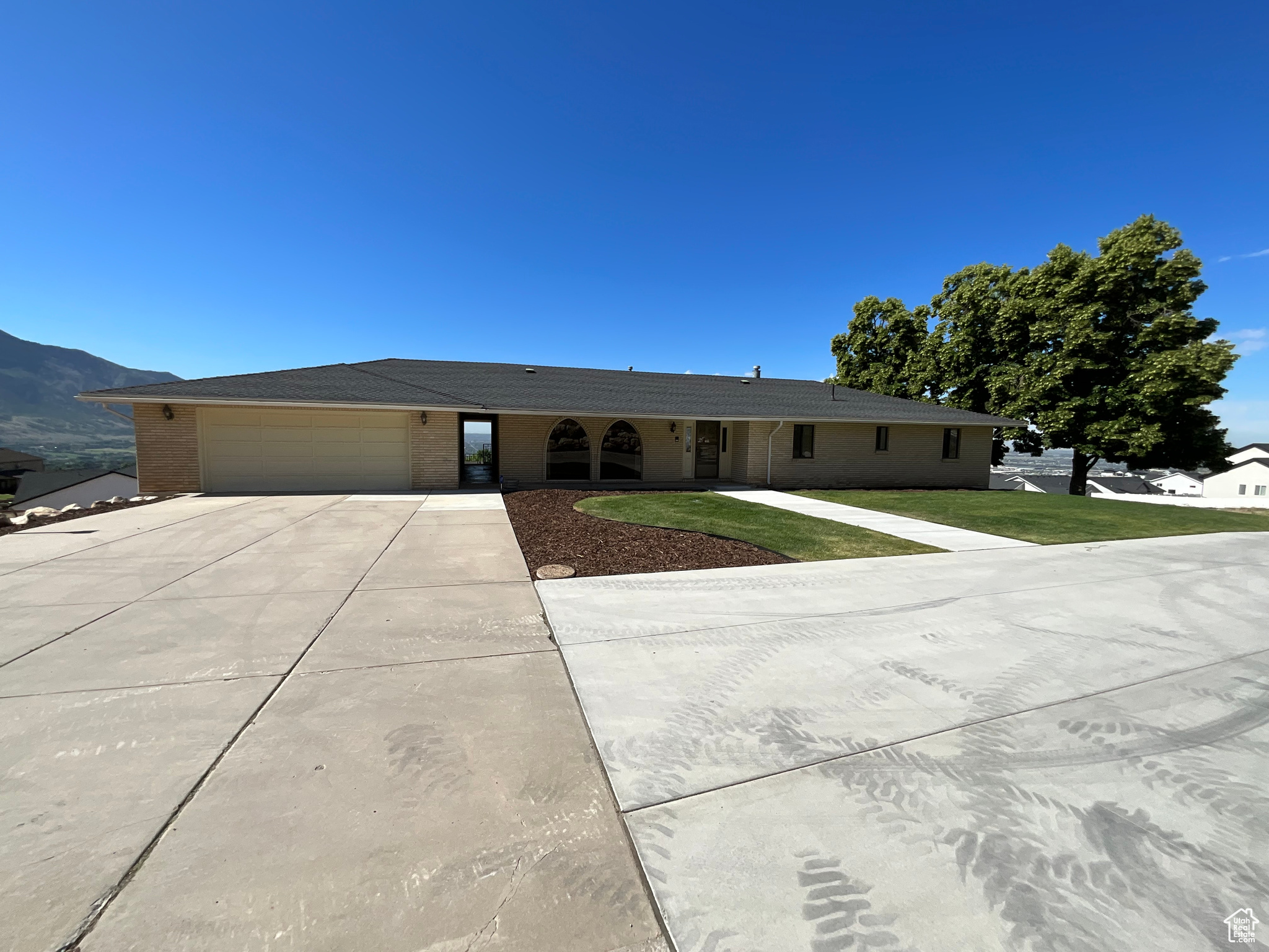Easy to show this immaculately kept one owner home. Huge covered deck and patio with breathtaking views of the mountains and the valley. Open floor plan with two full kitchens, 4 bedrooms and 4 bathrooms. 4 Car Garage. Come see it today!