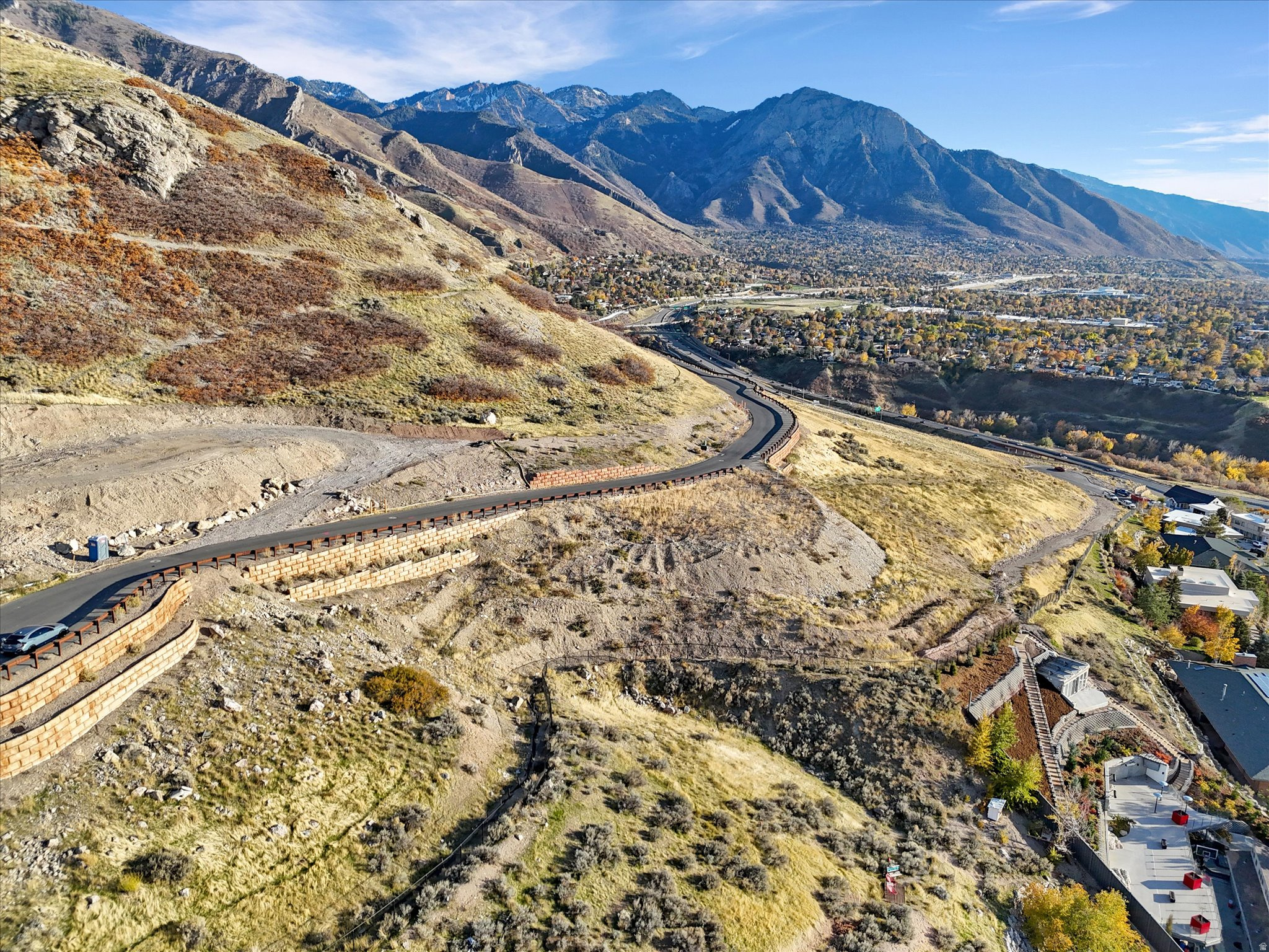 This standout lot is back on market and ready for your dream home. It offers panoramic views of the Great Salt Lake, the city skyline, and the surrounding mountains-views you can enjoy from every level of the property. Located in Cannon Cove, a gated community high on Salt Lake City's east bench at the mouth of Parley's Canyon. Several homes are under construction now, with high-end contemporary homes rivaling Tavaci in Cottonwood Heights.The developer donated 272 acres of surrounding land to the city, so your views and open space are protected forever-no future building to block them. Gated community with direct access to an extensive hiking trail system. A ramp and documented fill (from the lot across the street)  were added for previous owners and sold as-is. Head up Cannon Point Drive to see it yourself-the elevation and outlook alone are worth the trip. Turn the dream opportunity into your reality!