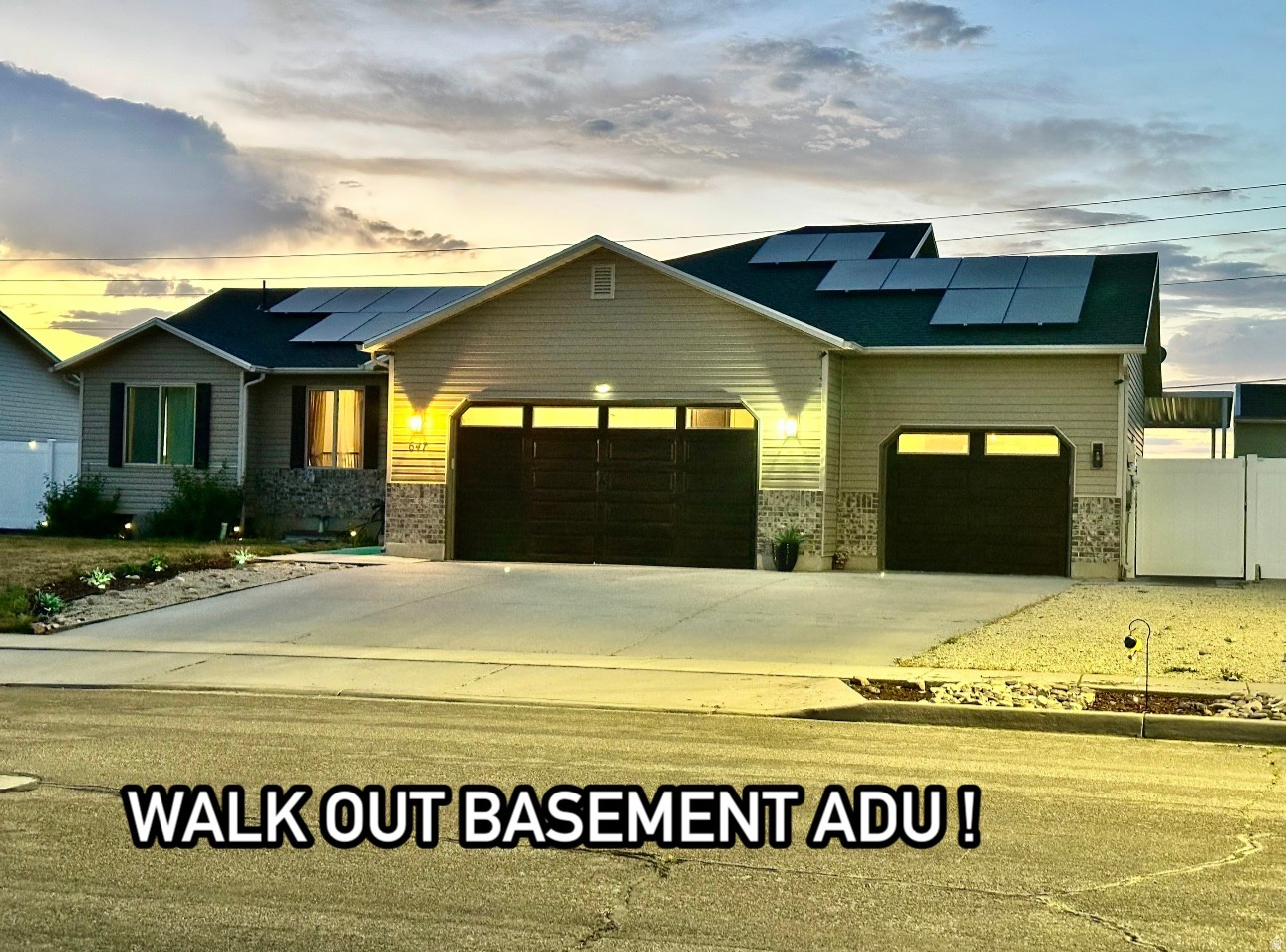 New updates as of May 2026. Beautiful and updated Rambler offering 4/3 plus an additional office/ bonus rm, Amazing mountain views in a prime Tooele location! The main level features a stylish open-concept layout that's perfect for everyday living and entertaining. One of the standout features is the spacious 3-car garage-Offering ample space for two vehicles plus toys or a workshop. The downstairs basement with its own private entrance was just converted into a mother-in-law suite or rental unit with the addition of a new kitchen, new kitchen cabinets flooring and lighting plus a new dishwasher to convey. Enjoy lower Utility bills with Recently installed solar panels that have been paid off - all of this with the convenience of being just minutes from shopping, dining, and Tooele's commercial center-while still being close to outdoor recreation and mountain adventures and blocks from A new beautiful park with walking paths and playgrounds. Whether you're looking for multi-generational living, income potential, or simply more space, this home delivers. Property sold as is. Brand new appliances in basement apartment as well as kitchen appliances in main home. Don't miss out-schedule your private showing today! oh and there is no HOA!