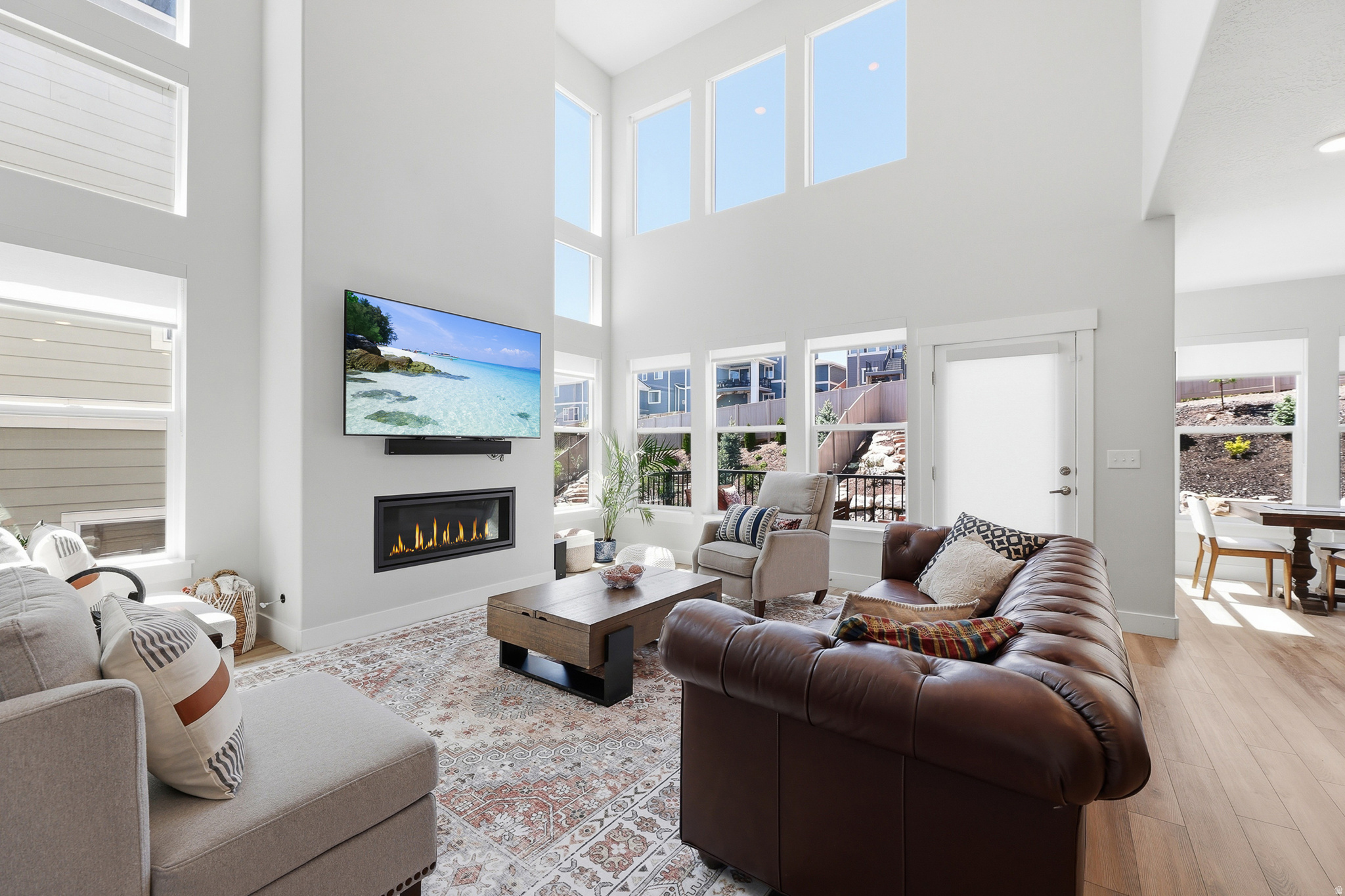 Thoughtfully designed and extensively upgraded, this exceptional Draper home offers true turnkey living in one of the area's most sought-after communities and feeding into the Canyons School District. Bright, light-filled living spaces flow seamlessly into a gourmet kitchen featuring quartz countertops, double ovens, a vented hood, ceiling-height backsplash, soft-close cabinetry, rollout waste storage, and designer finishes throughout. Tall ceilings, an open-concept floor plan, and a fully finished basement create a home that feels both sophisticated and highly functional, offering flexible living space for entertaining, working from home, or everyday family life.  The luxurious primary suite serves as a private retreat, capturing breathtaking mountain views and featuring a spa-inspired ensuite bathroom with a soaking tub, Euro glass walk-in shower, and dual vanities. In addition to the primary suite, the home offers three generously sized bedrooms, each with large closets and ample space for family members, guests, home offices, or hobbies.  Outdoor enthusiasts will appreciate the rare direct trail access from the backyard to Corner Canyon's extensive trail network, offering miles of hiking, running, and mountain biking trails for every skill level-right outside your door.  Thoughtful design extends to the home's practical features, including a tandem third-car garage bay and immediate access to a spacious mudroom, making it easy to stay organized and keep the home tidy through every season.  Located in the heart of Suncrest, this beautifully finished Hamlet Home provides access to one of Draper's most vibrant and connected communities. Just a short walk from the community clubhouse, residents enjoy a fitness center, swimming pool with lazy river, hot tubs, parks, and a year-round calendar of neighborhood events including BBQs, movie nights, holiday celebrations, jazz socials, and community gatherings. Situated within the highly acclaimed Corner Canyon School District, this home offers an unmatched combination of lifestyle, recreation, and community.  Combining premium upgrades, stunning views, direct trail access, spacious bedrooms, and the unique Suncrest lifestyle, this is more than a home-it's a place to truly live, connect, and thrive. Opportunities like this don't come along often. Come experience everything this exceptional home has to offer.  Square footage measures from appraisal, buyer to obtain an independent measurement.
