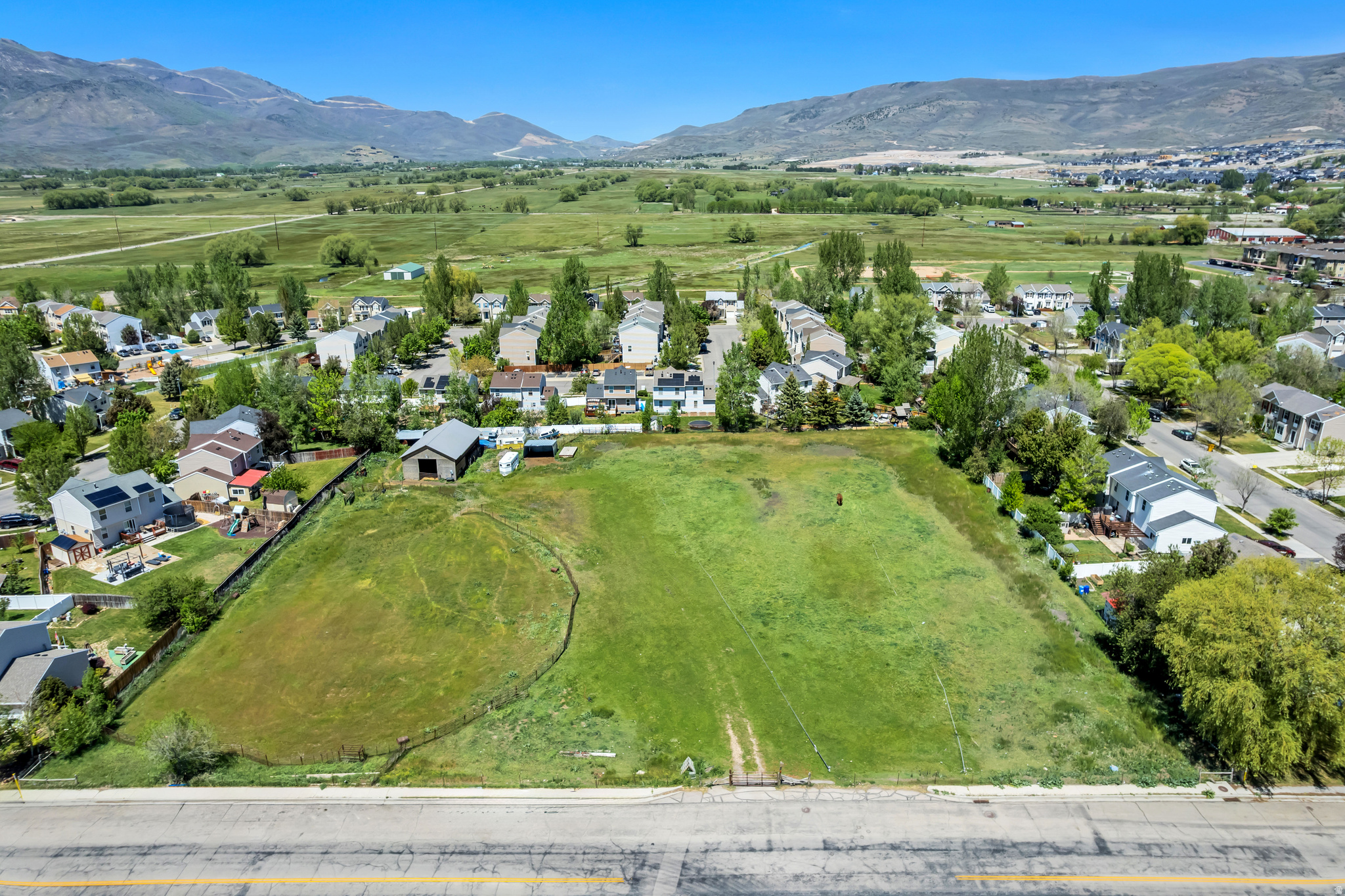 **MULTIPLE OFFERS RECEIVED** HIGHEST AND BEST BY 5/24/26. Prime 2.4-Acre Development Opportunity in Heber City  Located at 300 W 500 N in Heber City, this 2.4-acre property presents an incredible opportunity for developers, investors, or builders looking for land in a rapidly growing area. Previously utilized as a horse property for decades, the land is currently zoned residential and offers excellent potential for a variety of future uses.  Ideally situated close to town and Main Street, the property could be well suited for single-family homes, townhomes, condos, or potentially even future commercial use subject to rezoning approval. Utilities are already positioned to help streamline development, including water and sewer stubbed to the property and gas available at the road for easy connection.  Additional improvements and utility information include:  6-inch sewer line stubbed in and capped at the fire hydrant 2-inch water line stubbed in and capped Water and sewer impact fees already paid for one home Electrical already run to the property  This is a rare chance to secure acreage with strong development potential in one of Utah's most desirable mountain communities.  Buyer and buyer's agent to verify all information, zoning, utilities, development possibilities, and future use potential.