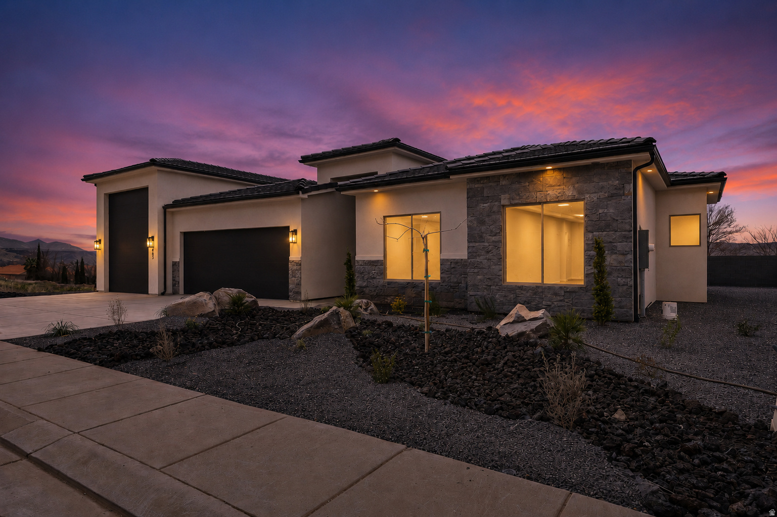 Modern design, open layout, and plenty of room for storage, toys, or adventure-ready living. The RV Garage features a 12' wide door with 14' of height with the depth a little over 48'. The kitchen features quality wood cabinets, quartz countertops, and black plumbing fixtures. The large island is perfect for entertaining. The primary suite offers a walk-in closet and unobstructed view of Pine Valley Mountain. Enjoy the convenience of single-level living with stylish touches and ample storage for everything you need. Contract the listing agent to schedule your showing today.