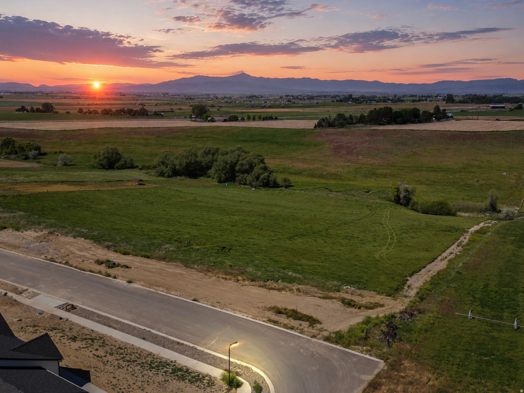 Beautiful 2.60-acre residential building lot located within Preston city limits and ready for construction with power, gas, water, and sewer stubbed to the property. Includes 6 shares of irrigation water and animal rights, making it ideal for horses, livestock, gardening, or a hobby farm. Enjoy breathtaking valley and mountain views, peaceful country living, and easy access to shopping, local lakes, hunting, fishing, hiking, and outdoor recreation. Just 20 minutes from Logan, Utah. Approximate address is 811 S 1100 E, Lot #11. Address TBD. Rendering shown in one photo is for visual concept only; no structure currently exists on the property. Buyer and buyer's agent to verify all information.
