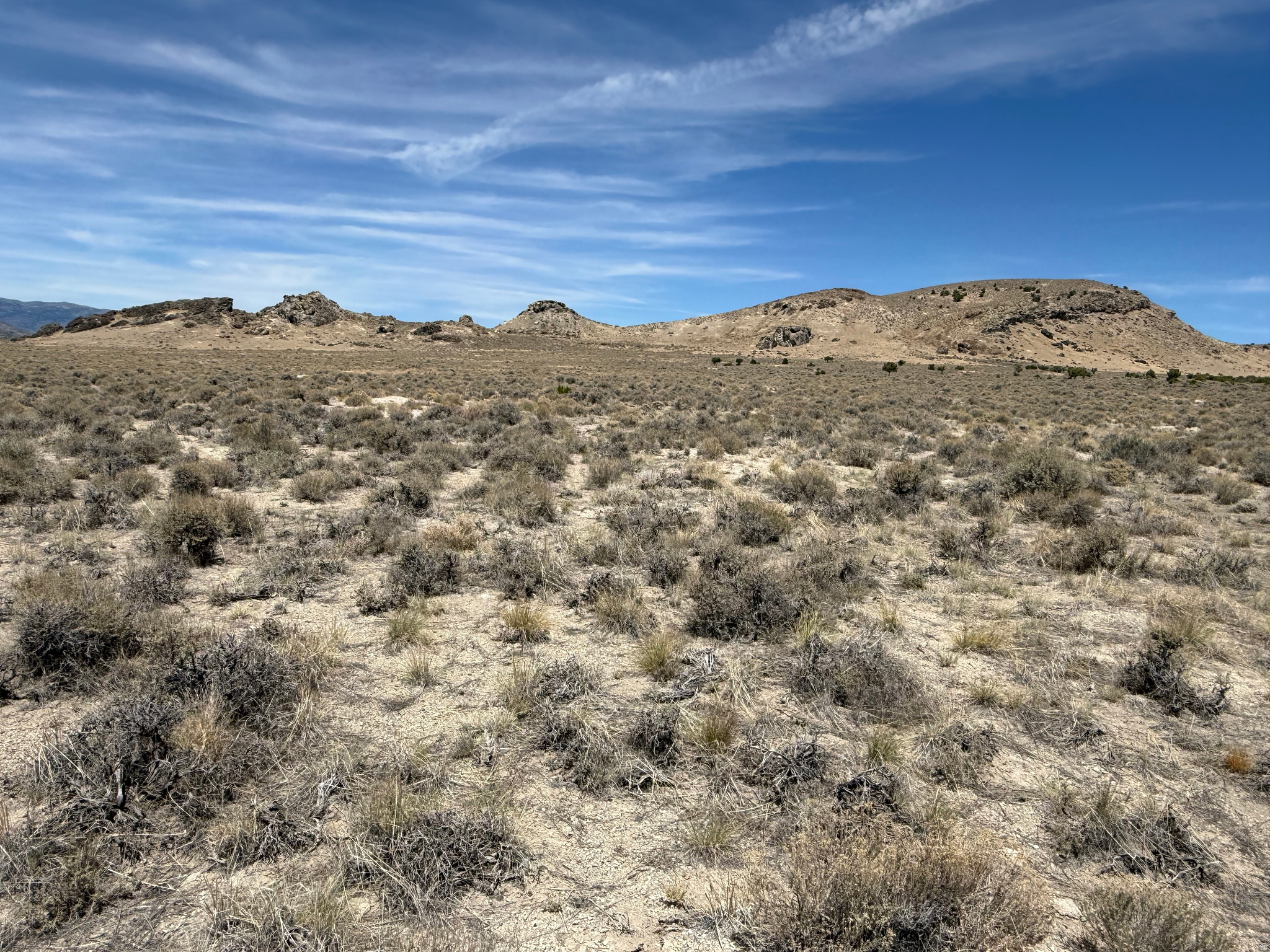 A RARE OPPORTUNITY-TO OWN 160 ACRE PARCEL WITH A COUNTY MAINTAINED ROAD GOING THROUGH IT! Located approximately 2.7 miles off of HWY 30 and easy access- This property is bordered and fenced by Utah State Lands on the north boundary and has a natural gas pipeline paralleling Emigrant Trail Road on the south side of the road. This expansive area of land offers stunning desert and mountain views in the distance with wildlife occasionally passing through, while yet, allowing for opportunities such as: camping, hiking, ATV'ing, stargazing, investment and more. Thus, making it the ideal spot for the perfect getaway and a great property to own. Hurry, don't miss out! Buyer, Buyers Agent and others involved to verify the accuracy of all Information. Information was provided as a courtesy only. Please contact listing agent for all showings & questions.