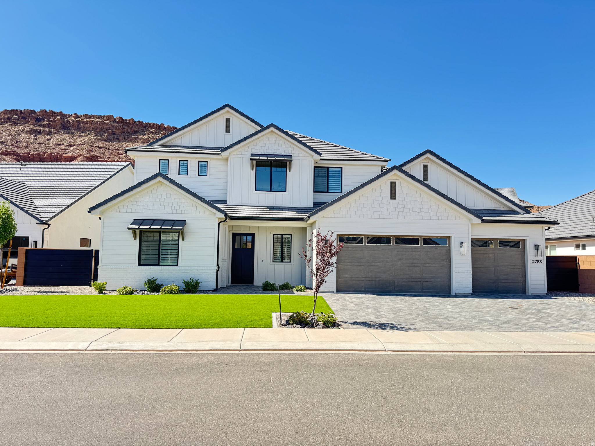 Beautiful home tucked in a quiet cul-de-sac in Red Mesa subdivision! Featuring an expansive yard with awning, artificial turf, low maintenance plants & paver patios/driveway. Spacious layout with an impressive 2 story entryway, picture windows & 10' ceilings on the main level. Massive kitchen featuring Cafe appliances, quartz countertops, large island, butler pantry & extra cabinetry. Primary suite boasts a private thermostat, dual vanities, walk-in shower, garden tub & walk-in closet. High-end finishes throughout including motorized blinds, plantation shutters, hardwood floor, quartz countertops, artistic millwork, upgraded light fixtures, custom cabinetry & ample storage.
