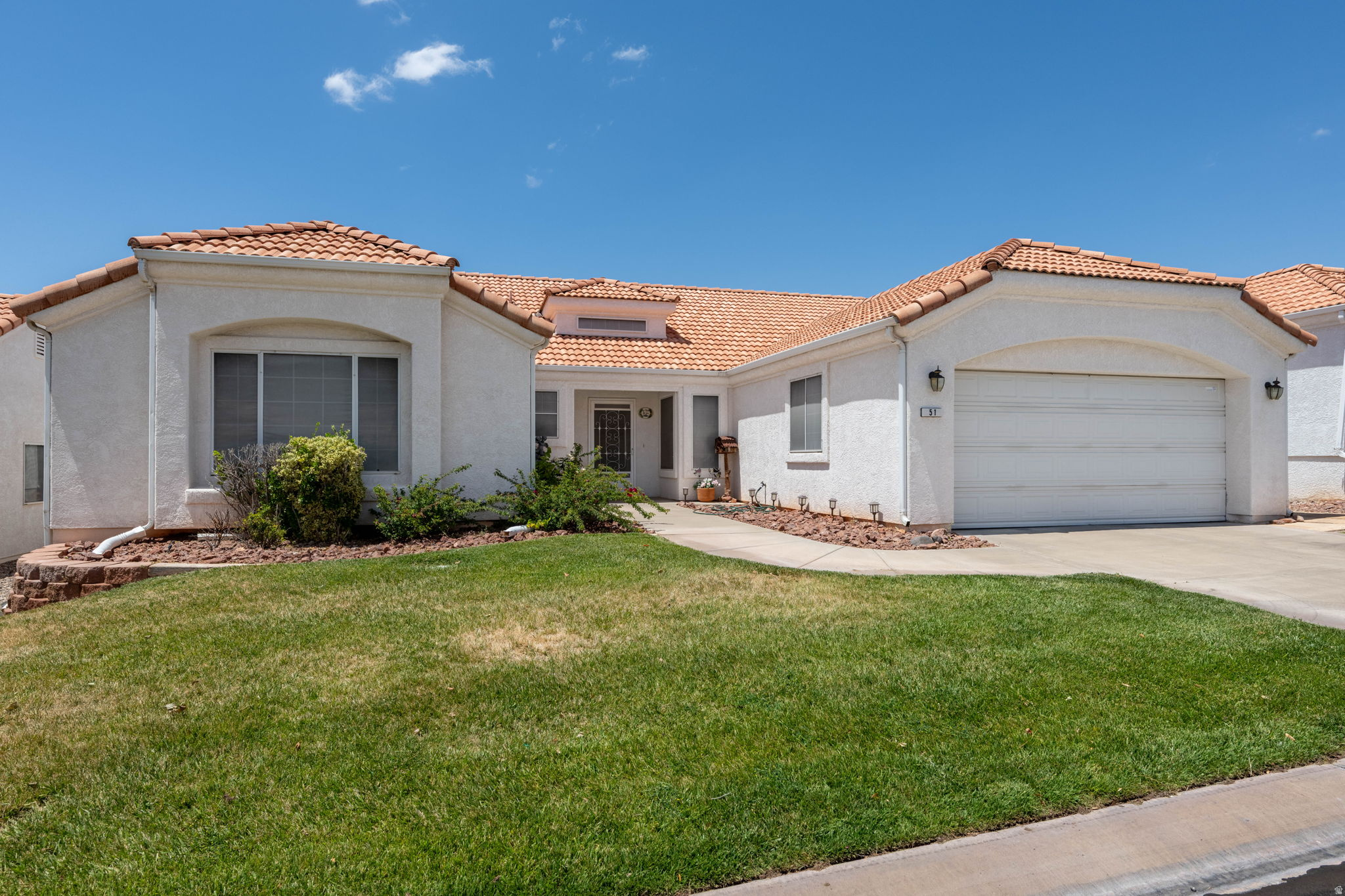 Welcome to Vista Del Sol  Active 55+ Living in the Heart of St. George! This spacious 4-bedroom, 2-bathroom home is ideally situated in the highly desirable Vista Del Sol 55+ community, offering comfort, convenience, and an exceptional lifestyle. The home features custom shelving throughout, providing both style and functionality, while the kitchen is equipped with stainless steel appliances for a modern touch. The two-car garage includes wall-to-wall cabinetry, creating abundant storage space for hobbies, tools, and seasonal items. Additional upgrades include ceiling fans, custom draperies, and security screen doors on both the front and back entrances, allowing you to enjoy fresh air with added peace of mind. Residents of Vista Del Sol enjoy access to outstanding community amenities, including a swimming pool, hot tub, clubhouse, and tennis courts. The beautifully landscaped grounds are meticulously maintained by the HOA, allowing for a low-maintenance lifestyle. Conveniently located in central St. George, this home is just minutes from shopping, dining, medical facilities, and everyday conveniences. Don't miss this opportunity to enjoy resort-style living in one of St. George's premier active adult communities!