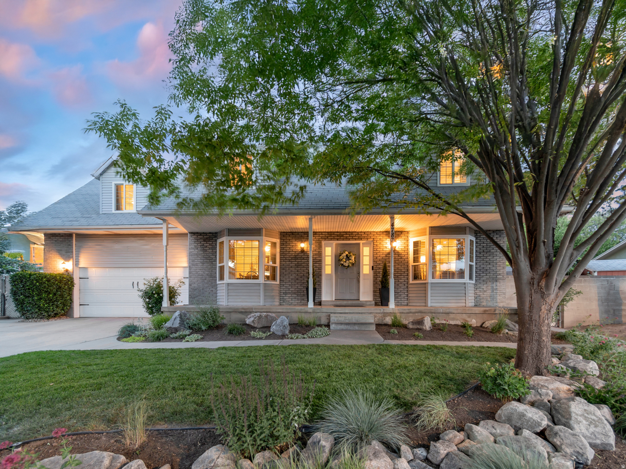 This is a home you walk into and don't want to leave. The owner is a professional designer, and it shows - from the stunning dry riverbed front yard to the beautifully manicured backyard, every detail has been thoughtfully curated. With 6 bedrooms, 4 bathrooms, and a fully finished mother-in-law apartment with its own private entrance, this home is perfect for multi-generational living or $1,450/month in documented rental income that offsets the mortgage from day one.  The open floor plan on the main level is as functional as it is inviting, flowing seamlessly into a granite kitchen with maple soft-close cabinets and a limestone backsplash. Updated light fixtures, fresh paint, a new sliding door, new Milgard windows, 2 Home Central Air units, and Google Fiber make this home feel like an experience rather than just a house.  The backyard is a true retreat - new lawn, a new automatic sprinkler system, mature landscaping, a charming apple tree, and a covered patio. A large driveway with RV and boat parking and an oversized garage complete this one-of-a-kind property. The location seals the deal - minutes from the freeway, Salt Lake International Airport, and downtown SLC.  The roof tells a story of ownership done right - added insulation, eave venting, and four turtle vents keep the attic cool, protect the shingles from heat damage, and extend service life well beyond a standard installation. A newer furnace, A/C, and newer garage door mean the big-ticket items are already taken care of. Come see it!   Square footage figures are provided as a courtesy estimate only and were obtained from an appraisal.  Buyer is advised to obtain an independent measurement.