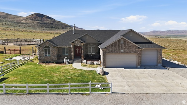 Views, Privacy & Endless Possibilities! This property is truly one of a kind! Situated on 13+ fully fenced acres, it offers complete privacy and breathtaking valley views that are hard to find. The home features a spacious open floor plan with vaulted ceilings, a large family room, and generously sized bedrooms-perfect for comfortable living and entertaining. New kitchen with a beautiful island and pull-out drawers with granite countertops. Finished basement with 3 additional bedrooms, brand new bathroom, large family room and you can't miss the comfy doghouse with new carpet. Enjoy peace of mind with a new roof 2026. Furnace and AC replaced 2024. Water pump system valued over $6000. You'll find an extra-large garage with RV parking, a fenced backyard with a fire pit, and plenty of room for animals, recreation, or whatever your vision may be. Additional 1.25 acre lot ideal for your next gun or archery range. (05-107-0075)   If you're looking for space, privacy, and incredible views, this property delivers it all!