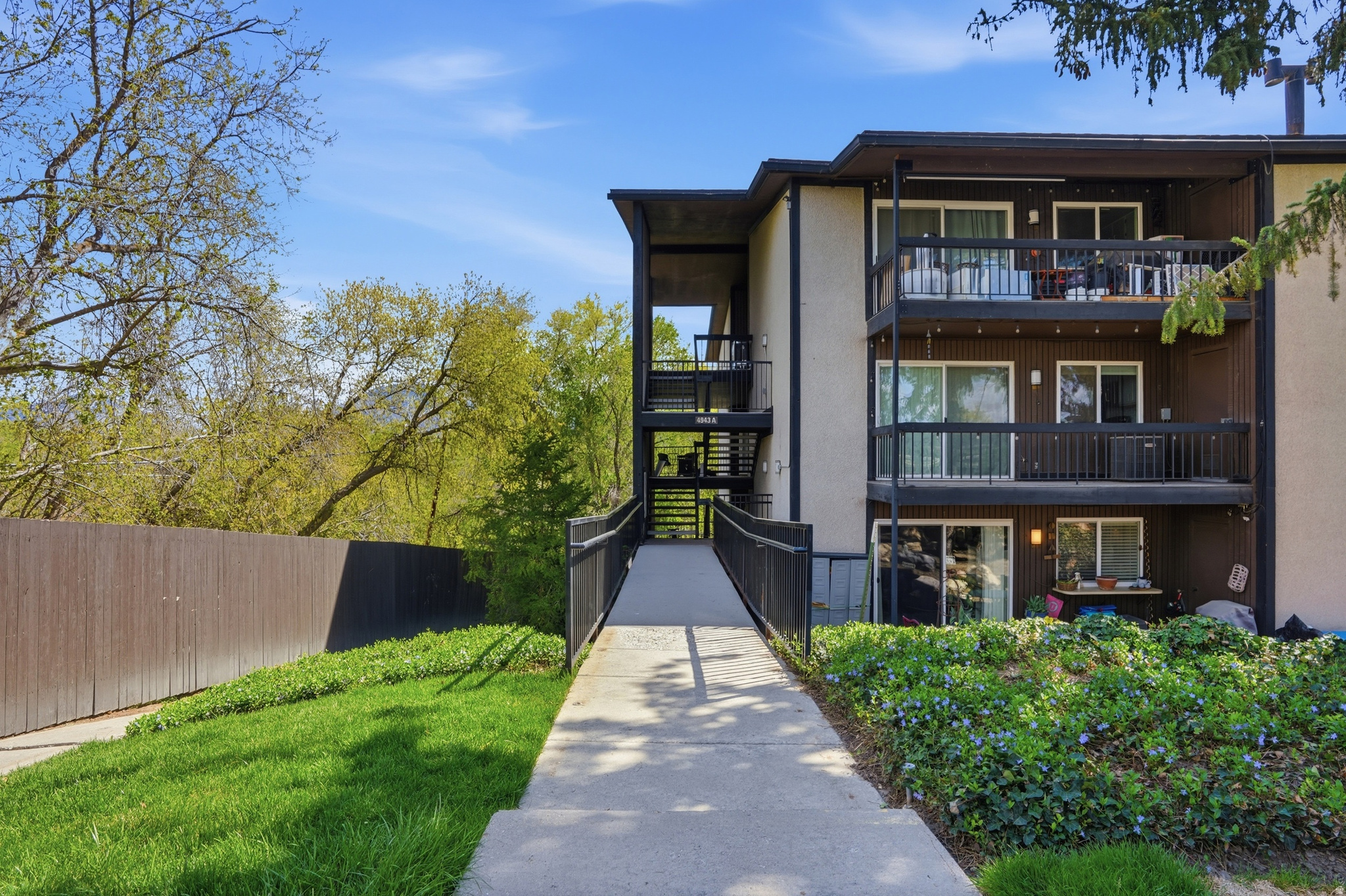 Seller will contribute $5,000. towards buyers mortgage buy down interest rate or closing cost with accepted offer by 6/29/26. Fountains East mid-level home, with extra huge private storage in the basement of the building. Pet friendly community, location is between Holiday and Murray. Close to shopping, dining with park like setting. Community pool a great place to relax. Remodeled, updated kitchen with quartz counter, stainless appliances included. Newer windows, sliding glass door, newer flooring. Two covered carport spaces for easy access to the unit. Located at the back corner of the complex, mature landscaping, well maintained complex. Owner/Agent