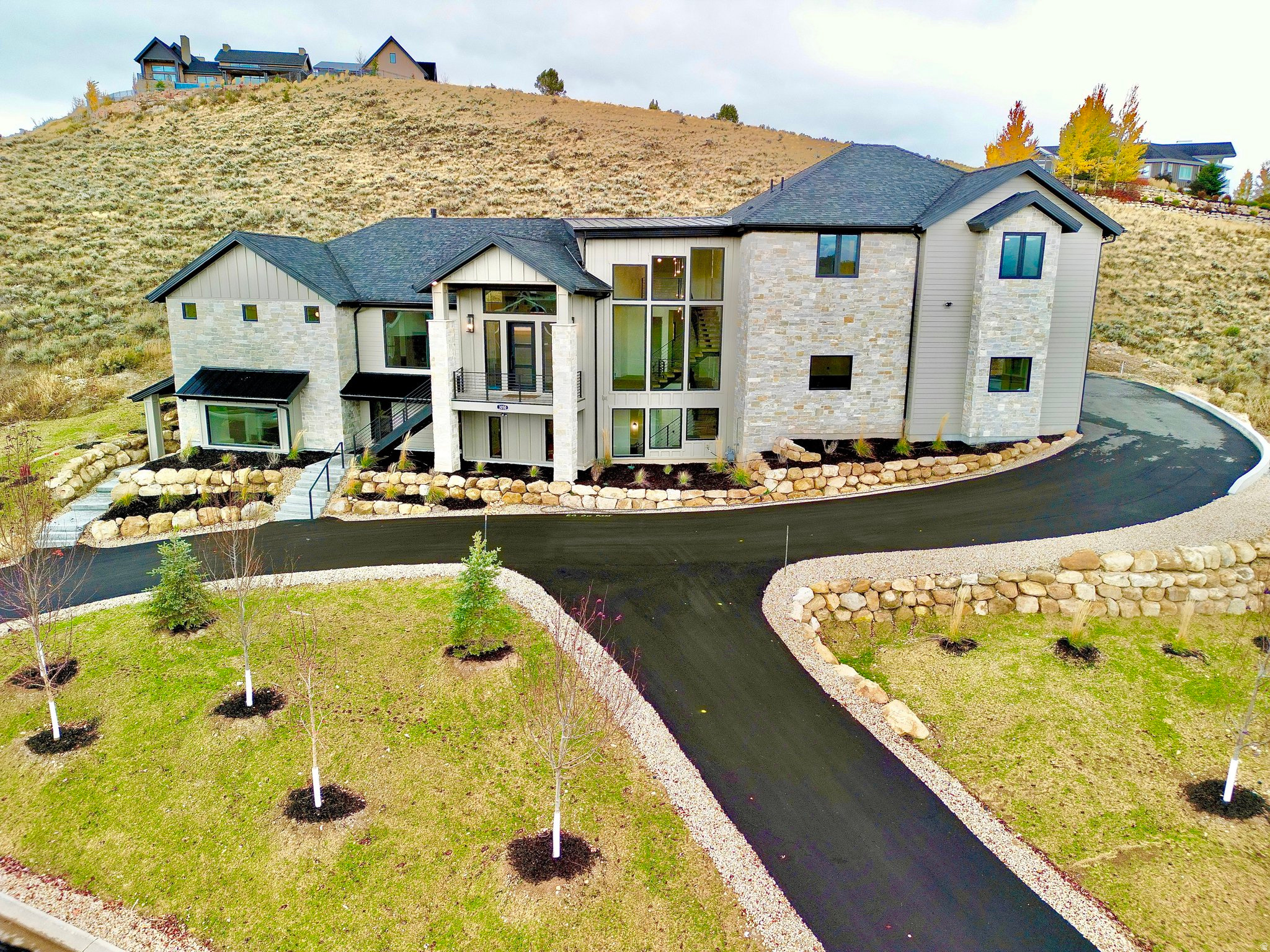 **MOVE IN READY, BRAND NEW HOME NEVER LIVED IN** With a $3.7 MILLION APPRAISAL IN HAND. EXTREMELY PRIVATE LOT - SELLER FINANCING AVAILABLE.*** Stunning 5-bed, 6-bath, 6,400 sq. ft. custom luxury home in one of Heber City's most desirable communities, just 10 minutes from the new Deer Valley East Resort. Enjoy sweeping Mount Timpanogos views and exceptional privacy with an adjacent lot that will never be built on. This home features heated floors throughout, high-end finishes, and a fully independent, single-level ADU with private entrance, full kitchen, and living space-ideal for guests, extended family, or rental income. A massive 6-car garage with epoxy flooring offers ample space for vehicles and gear. Perfectly positioned for world-class skiing, outdoor recreation, and refined mountain living, this rare property offers luxury, privacy, and versatility in one exceptional retreat. Square footage figures are provided as a courtesy estimate only and were obtained from Building plans. Buyer is advised to obtain an independent measurement.