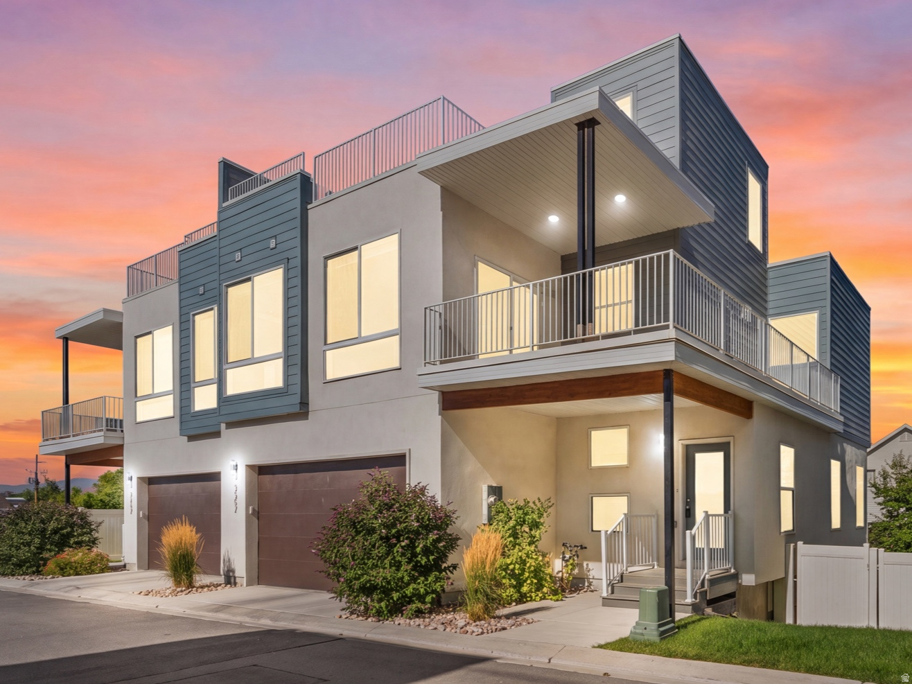 If you've been looking for a home with amazing views and outdoor space that's hard to find, this is it. Located in the gated Lofts on Redwood community, this end-unit townhome offers 2,652 square feet, four bedrooms, three bathrooms, and a two-car garage all with thoughtful upgrades that make it stand out from the rest. The main level has a bright, open layout that makes everyday living and entertaining easy. The kitchen features quartz countertops, custom cabinetry, stainless steel appliances, and an oversized walk-in pantry with plenty of storage. Just off the living area is a private deck, and upstairs you'll find over 800 square feet of rooftop living space with panoramic views of the Salt Lake Valley and surrounding mountains. With gas, water, and electrical connections already in place, including hookups for an outdoor TV, the rooftop offers endless possibilities to create your own outdoor retreat. Add a pergola, BBQ, fire-pit, outdoor kitchen, comfortable seating, or a bar, it's the perfect space to relax, entertain, and take in the incredible sunsets. The primary suite is a relaxing space with its own private wraparound balcony, a large walk-in closet, and a spa-like bathroom with an oversized dual-head shower. Downstairs, the finished basement provides additional bedroom, flexible living space that's perfect for a second family room, home office, gym, or whatever best fits your lifestyle. The fully fenced backyard is low maintenance and includes upgraded electrical with a concrete pad that's ready for a hot tub. It's also one of the few homes in the community with convenient sliding-door access to the backyard. Just 10 minutes from the airport and close to downtown, restaurants, shopping, and outdoor recreation, this home offers the convenience of city living while still feeling tucked away in a quiet, gated neighborhood. With incredible views, quality upgrades, and spaces designed for both relaxing and entertaining, this home is one you won't want to miss. Square footage figures are provided as a courtesy estimate only and were obtained from county record. Buyer is advised to obtain an independent measurement.