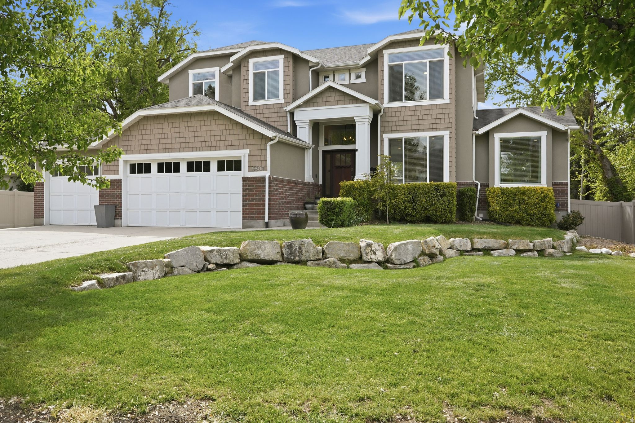 Impressive Custom Cottonwood Heights Home*This PRIME location features income potential, convenient access to freeways, shopping, dining, & world-class skiing*ENTERTAIN with confidence in your open concept main living area filled with natural light, large front & back windows, UPDATED LED can lighting, with seamless flow to your outdoor spaces*Enjoy your UPDATED kitchen with concrete countertops, subway tile backsplash, coffee nook, pantry, UPGRADED appliances including LG Thin Q smart refrigerator, Frigidaire oven with induction range, Samsung dishwasher, kitchen sink water filtration, under & over cabinet lighting*RELAX in comfortable living spaces featuring new LVP flooring, newer carpet, updated light fixtures, ceiling fans, & fresh clean finishes throughout*Primary & secondary bathrooms showcase UPDATED adult-height vanities, quartz marble-style counters, upgraded fixtures, & modern lighting*Your VERSATILE layout includes a FULL MOTHER-IN-LAW apartment with separate entrance, security tab hinges, private laundry, full kitchen, & strong rental/multi-generational living potential*Step outside to your PRIVATE backyard retreat featuring NEW UPGRADED composite deck with added electrical, reinforced structure for your hot tub, & cozy pergola, large yard, raised garden boxes with zoned auto sprinklers, privacy fencing, sports court, shed, & multiple entertaining areas*INCREDIBLE outdoor upgrades include new fencing, gravel side yard, sep private yard space for mother-in-law, rain gutters feature heat tape & leaf guards, & CUSTOM Govee exterior lighting, keyless entry, smart thermostat & Wyze doorbell* SYSTEM UPDATES within the last 3 years include: furnace, UPGRADED A/C, on-demand water heater, water softener*Functional UPGRADES include NEW toilets throughout, NEW sewer ejection pump, improved window wells, overhead storage racks in garage, & family room speakers*Additional UPGRADES include: NEW matching cordless blinds, extended 3rd car garage with minisplit, walk-in closet with organizer, coat closet, & UPGRADED laundry spaces on both levels, *Zoning for up to approx 2,500 sq ft ADU provides future expansion opportunity*This home offers the rare combination of UPGRADES, UPDATES, FLEXIBLE living, & PRIVATE outdoor lifestyle all in one!*Square footage figures are provided as a courtesy estimate only and were obtained from appraisal. Buyer is advised to obtain an independent measurement*Arrange a private tour today!