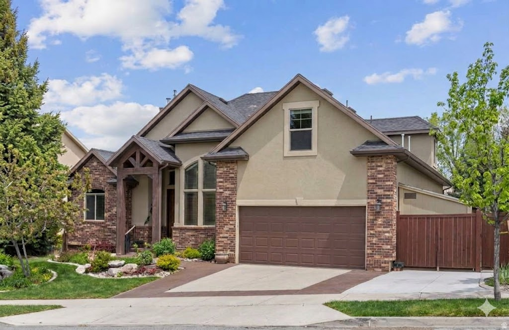 Tucked into the scenic hills of Suncrest, this home combines breathtaking views with the lifestyle people love about mountain living. Hard to find 2 story w/ main level living that includes beautiful vaulted ceilings & open concept. You'll love entertaining with the kitchen, great room, dining & gorgeous patio that is perfect for gathering with family & friends. The spacious primary suite (also on the mail level) offers a relaxing retreat with a walk-in closet, step in shower & large garden tub. Downstairs, the private entrance & finished basement create endless possibilities for guests, a mother-in-law apartment or additional living space w/ kitchenette, flex room & theater! Upstairs has 3 unique bedrooms & a full bath to share. Outside, the fully landscaped yard is made for quiet evenings & enjoying the fresh mountain air, unbelievable views and access to incredible amenities, trails, gym, clubhouse & pool!