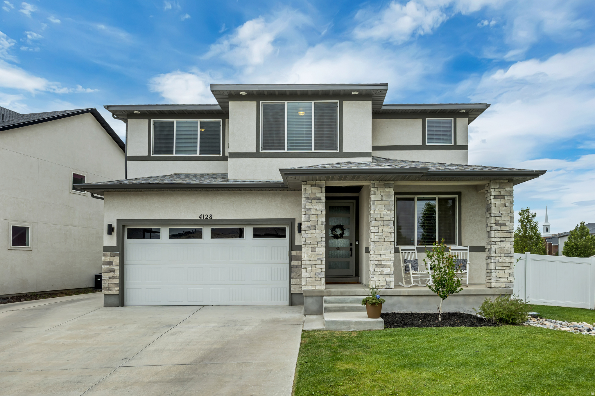 Welcome to 4128 E Sun Crest Dr, a former model home on a premium corner lot in the highly sought-after Ranches community. Offering 3,254 sq ft with 2,576 sq ft of finished living space, this beautifully maintained 4-bedroom, 2.5-bath home features mountain views, RV parking, thoughtful upgrades, and one of the builder's most popular floor plans. Filled with natural light, the open-concept main level showcases a stunning gas fireplace with custom royal blue tile, spacious family room, dining area, and a versatile flex room ideal for an office, playroom, or additional living space. The chef-inspired kitchen features a gas cooktop, double ovens, abundant cabinetry, expansive counter space, and a large walk-in pantry. Just off the garage, a thoughtfully designed mudroom with a built-in bench and storage cubbies adds everyday convenience an organization. Upstairs, the spacious primary en suite offers a soaking garden tub, separate glass enclosed shower, dual vanities, and an oversized walk-in closet. Three of the four bedrooms feature walk-in closets with custom shelving. The loft provides additional flexible living space. Upstairs laundry adds convenience. The unfinished daylight basement offers endless possibilities for future bedrooms, living space, a home gym or theater room. Outside, enjoy a fully fenced and professionally landscaped front and back yard, charming front porch, RV parking, and a 2-car garage. Located on the Saratoga Springs/Eagle Mountain boarder, near Ranches Golf Course, parks, schools trails, shopping, dining, and commuter routes. Come fall in love with 4128 E Sun Crest.    *Square footage figures are provided as a courtesy estimate only and were obtained from tax records.  Buyer is advised to obtain an independent measurement.