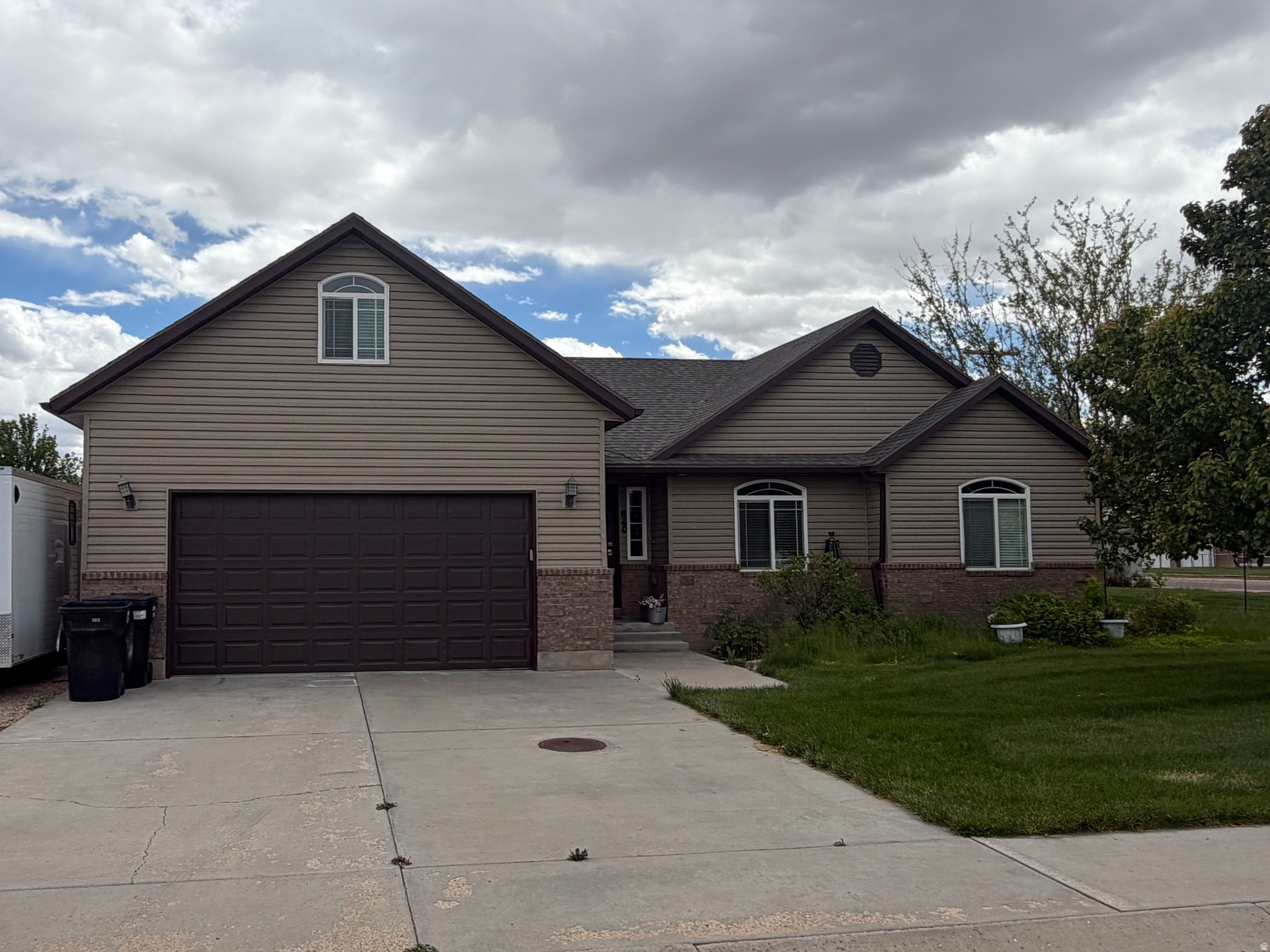 Enjoy single-level living in this beautiful home. The Vaulted living area opens onto the dining room and kitchen. There is also a large bonus room upstairs. Appreciate the large corner lot with abundant lawn & landscaping. Trees, shrubs, and flowers abound around the large lawn, which is all auto-watered. There is a garage for the cars and a shed for the lawn & garden equipment. You will also find a large cemented storage area in the crawl space and a newer, efficient tankless gas water heater.
