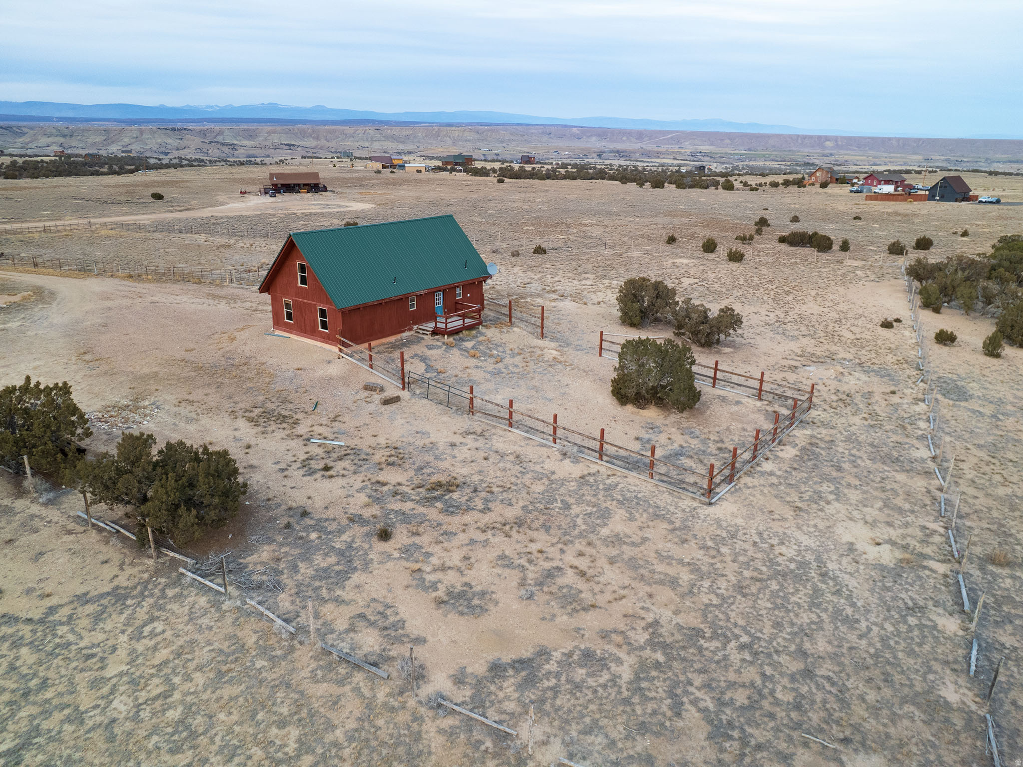 BRING YOUR HORSES!! 2.5 acres!  Fenced and cross fenced! Culinary water to the house and corral!  Miles of riding!  Then come home to 3 bedrooms, 1 and 3/4 baths, laundry room by the back door, and open living room/kitchen floor plan! Updated furnace/central air, water heater, Stackable washer/dryer, fridge, and a new metal roof!  2 lofts are easily more bedrooms or bunk rooms for the kids and grandkids!  Beautiful big beams!  2 sets of stairs to the lofts!  Covered deck out the front door  for viewing your horses!  Shed, Tack Shed and a fenced Arena all included! Separate fenced back yard for the dogs or kiddos! Come on over!  We will show you!