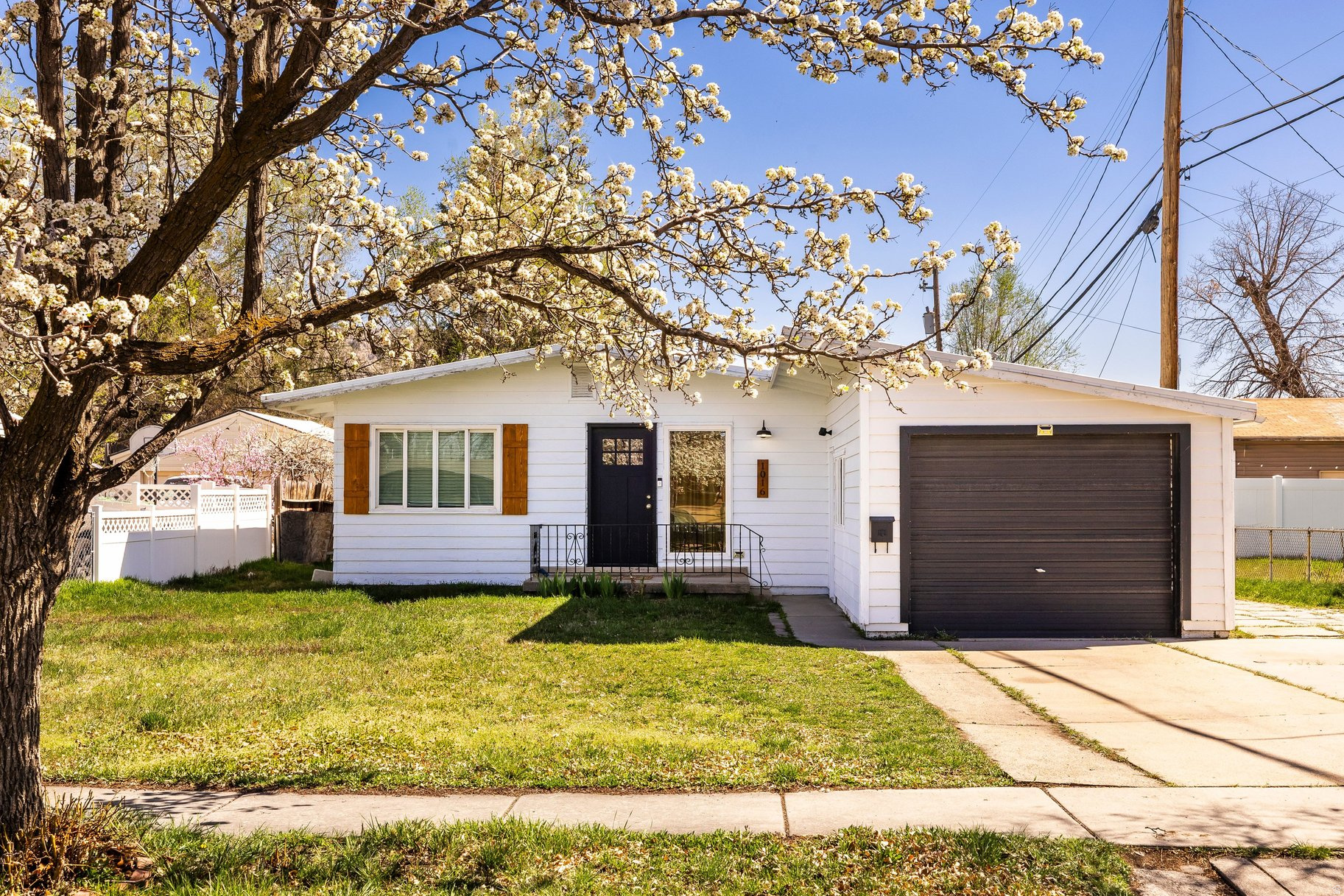 OPPORTUNITY FOR RATE BUYDOWN FOR THE RIGHT OFFER. Contact agent for details. Beautiful mid-century modern rambler located in North Rose Park! This cool and sophisticated home is the perfect starter home or ideal for anyone looking for true single-level living. The attached one-car garage adds everyday convenience and long-term value. The updated kitchen features a tapas-style counter-perfect for casual dining, entertaining, or gathering with guests. Abundant natural light fills the home, creating a warm and inviting atmosphere throughout. With all square footage on one level, the layout offers both comfort and functionality. Pride of ownership shines with thoughtful upgrades completed within the past three years, including luxury vinyl flooring, kitchen improvements, a new water heater, and a new sewer liner. Ideally located for convenience and lifestyle, this home offers quick access to Salt Lake International Airport, downtown SLC nightlife, dining, and sporting events-making it a commuter's paradise.