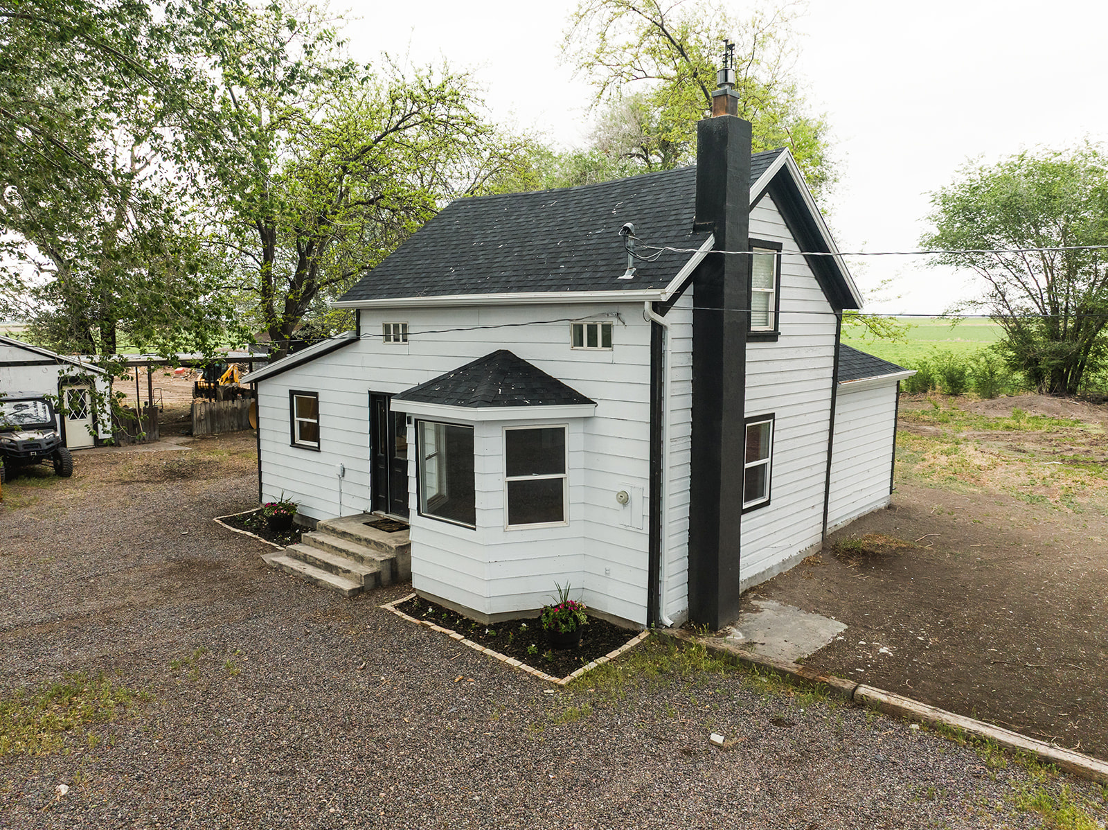 Charming Farmhouse with endless potential and all the cozy country vibes! Perfect for a homestead starter package with room for animals, gardening, hobbies, and simple living. Enjoy peaceful surroundings, rustic charm, and the opportunity to create our own little slice of country paradise!  New Gutters, Roof and Exterior paint in 2025. Septic tank was also recently pumped.  Square footage figures are provided as a courtesy estimate only and were obtained from Appraisal .  Buyer is advised to obtain an independent measurement.