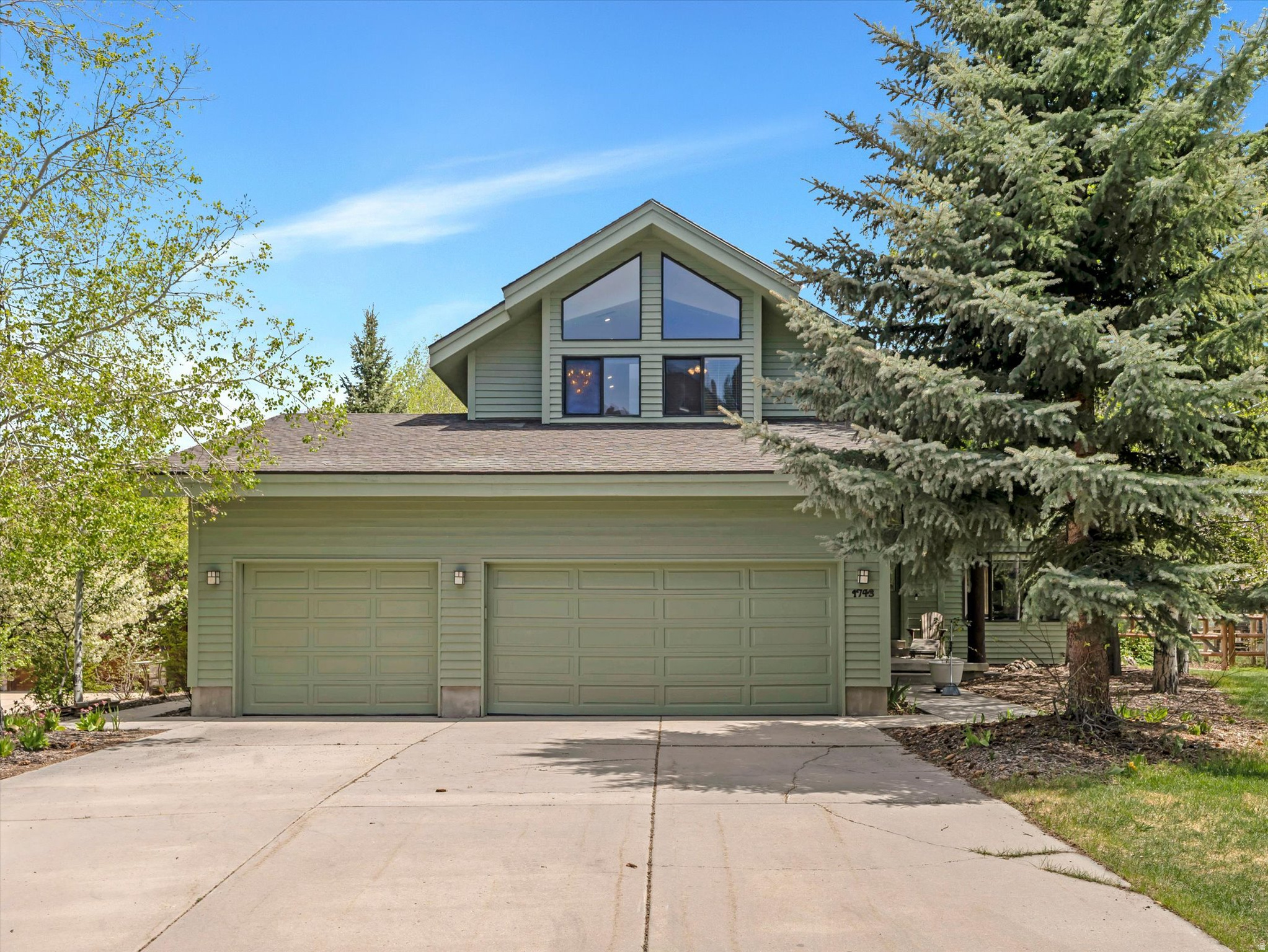Tucked into Park City's sought-after Silver Springs neighborhood and within the Park City School District, 1743 Walker Court blends comfort, style, and effortless mountain living. This 4-bedroom, 3.5-bath home features a bright, open layout with inviting gathering spaces, a well-appointed kitchen, and generous windows framing scenic views. The main level offers exceptional flexibility with a bedroom, full bathroom, and kitchenette--ideal for guests, mother-in-law suite, or potential ADU use. Set on a large, private fenced yard with a tranquil trout stream and multiple mature apple trees, pear tree, apricot tree, cherries and grapes, the outdoor space feels like your own hidden retreat. A spacious 3-car garage provides ample room for all your gear, while world-class skiing, trails, dining, and historic Main Street are just minutes away--making this the perfect basecamp for year-round adventure.
