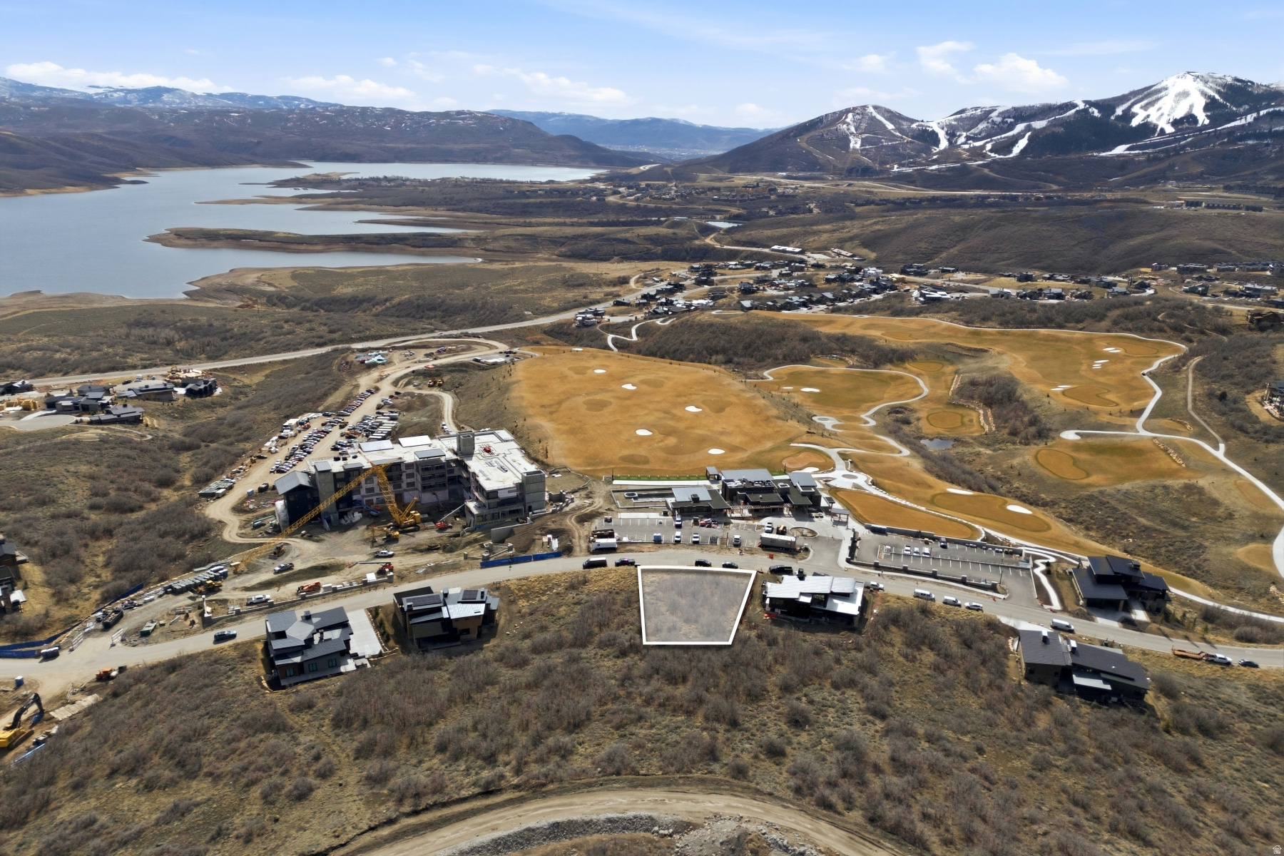This stunning .31 acre ready to build homesite in SkyRidge offers the rare opportunity to build your dream mountain home up to 6000 livable square feet, with breathtaking panoramic views of the majestic ski runs at Deer Valley Resort and the tranquil waters of the Jordanelle,   Walk across the street to the owner's club with pool and exercise studio, hotel with a luxury spa and fine dining restaurants, golf simulators, driving range and golf course, the amenities in SkyRidge are at your front door.  Look out your window to check the ski conditions at Deer Valley with views of the East Village Gondola and Bald Mountain. As part of the exclusive SkyRidge community, you'll have access to amenities that cater to your every need and desire. Offering a shuttle service from home to slopes, golf and a state-of-the-art clubhouse to a full-service pro shop and a gourmet market cafe & iconic bar, every detail has been thoughtfully curated. And for those who seek a balanced lifestyle that seamlessly blends adventure with relaxation, SkyRidge Mountain Community offers the perfect home base for endless Park City exploring. Whether you're hitting the slopes at Deer Valley Resort, dining at world-class restaurants, or indulging in the vibrant cultural scene, this community provides the ideal backdrop for a life well-lived.