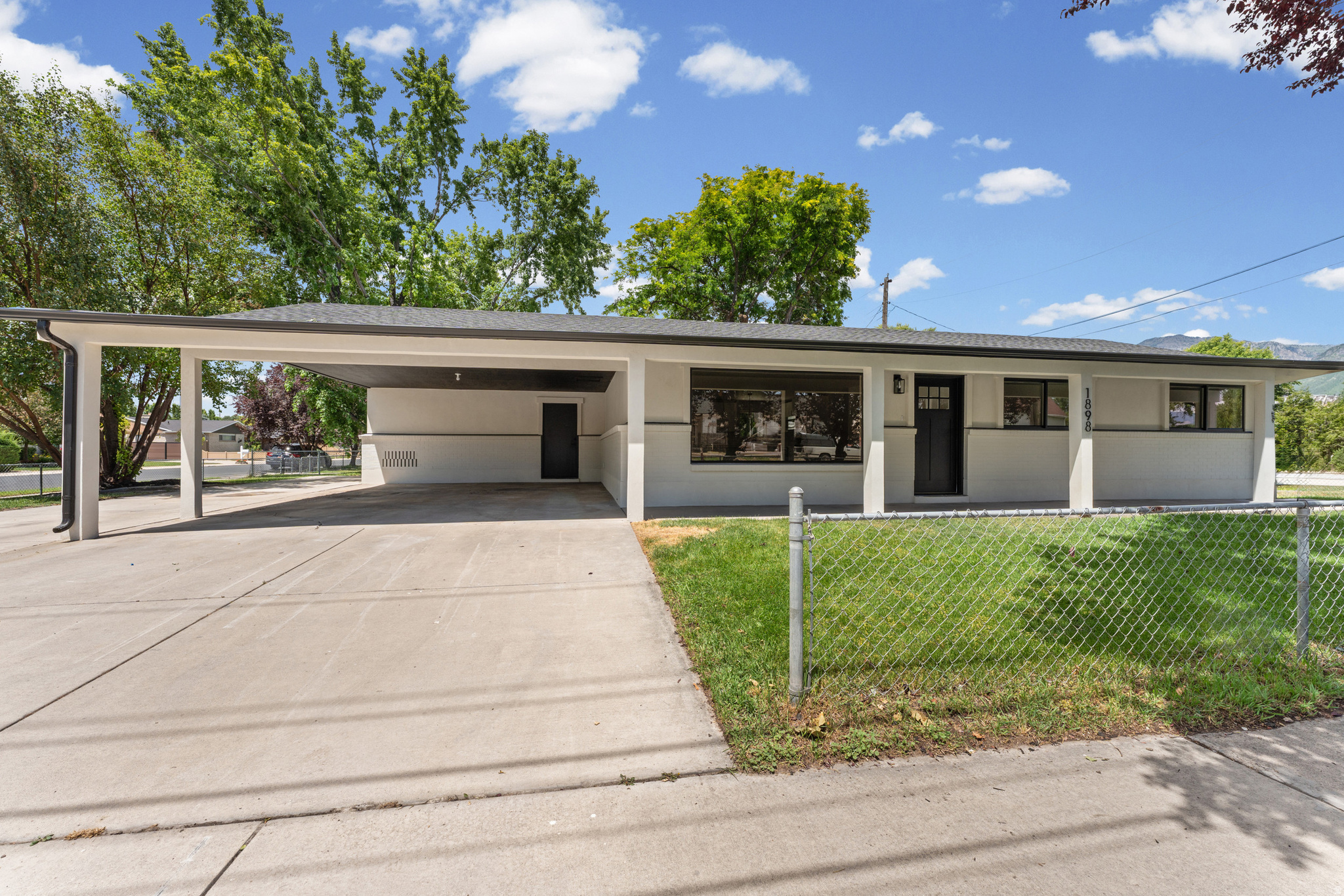 Stunning Fully Remodeled Rambler. Better Than New Construction! SAY BYE TO THE STAIRS!!! Thoughtfully reimagined with an open concept layout. Every detail has been updated, including a brand-new roof and exterior, giving you the look, feel, and peace of mind of new construction, without the new construction price tag. Inside, you'll find a bright, functional floor plan, along with beautifully tiled bathrooms that add a touch of luxury. The 4th bedroom boasts its own private entrance, making it perfect for guests, extended family, a home office, or potential rental income. With no basement, every square foot is finished living space, no paying for unfinished square footage here. This home offers the perfect blend of style, function, and value.  FULLY FENCED, CORNER LOT, SINGLE LEVEL LIVING, NEW APPLIANCES, BEAUTIFUL TILED BATHROOMS, OPEN LAYOUT, RV PAD, BRAND NEW ROOF, EXTERIOR, ETC.